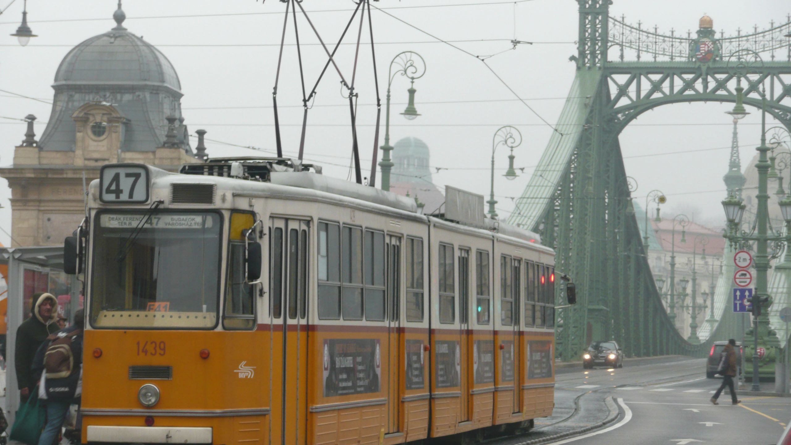 Yellow tram moving through Budapest Hungary