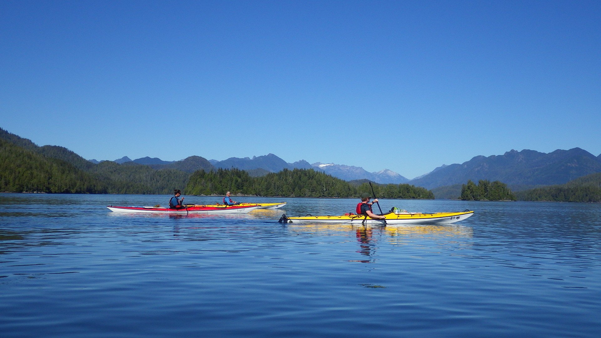 Ben and other travellers kayaking to Meares Island Vancouver Island Canada