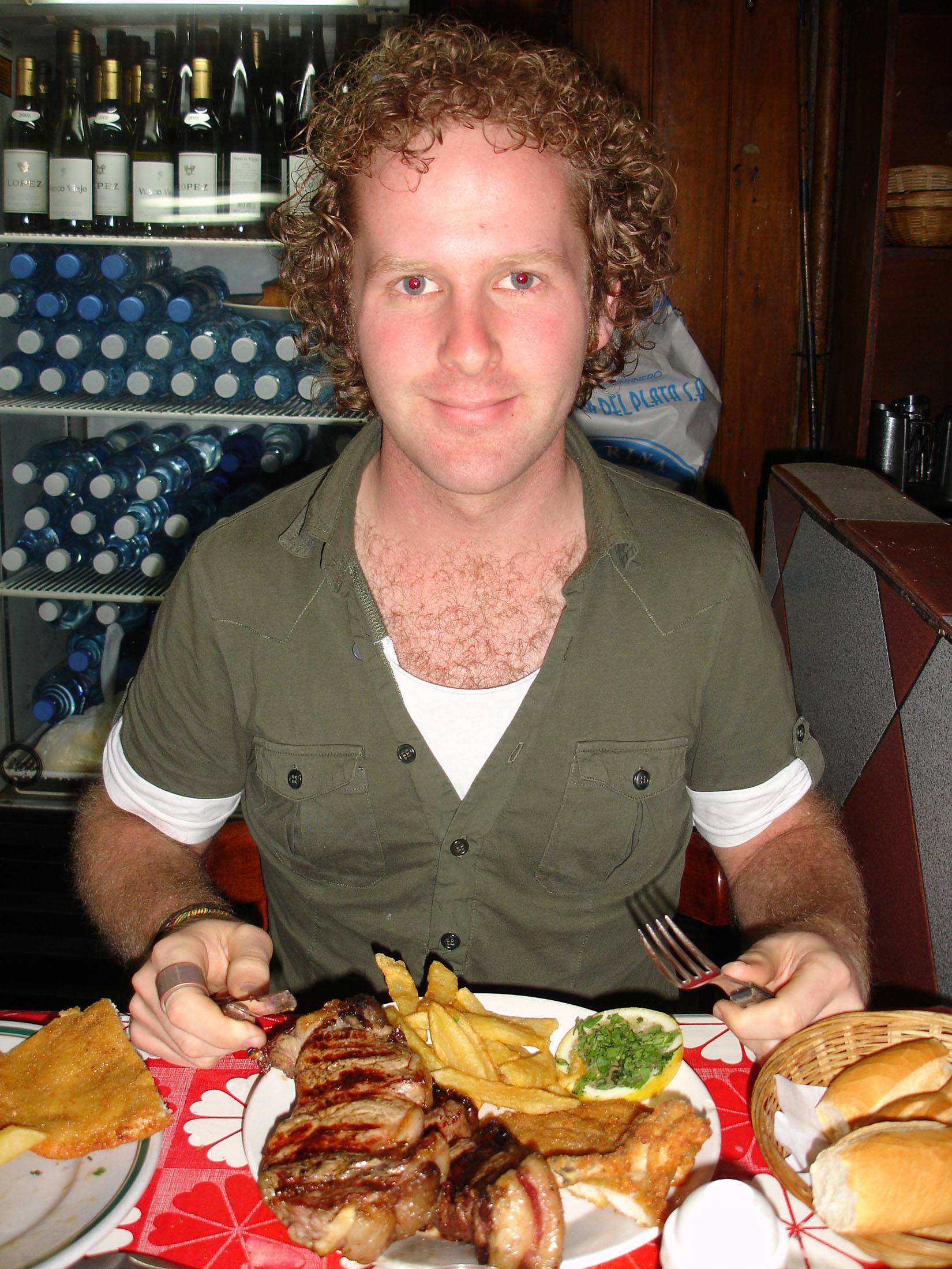 Ben eating a steak at a parrilla in Buenos Aires Argentina