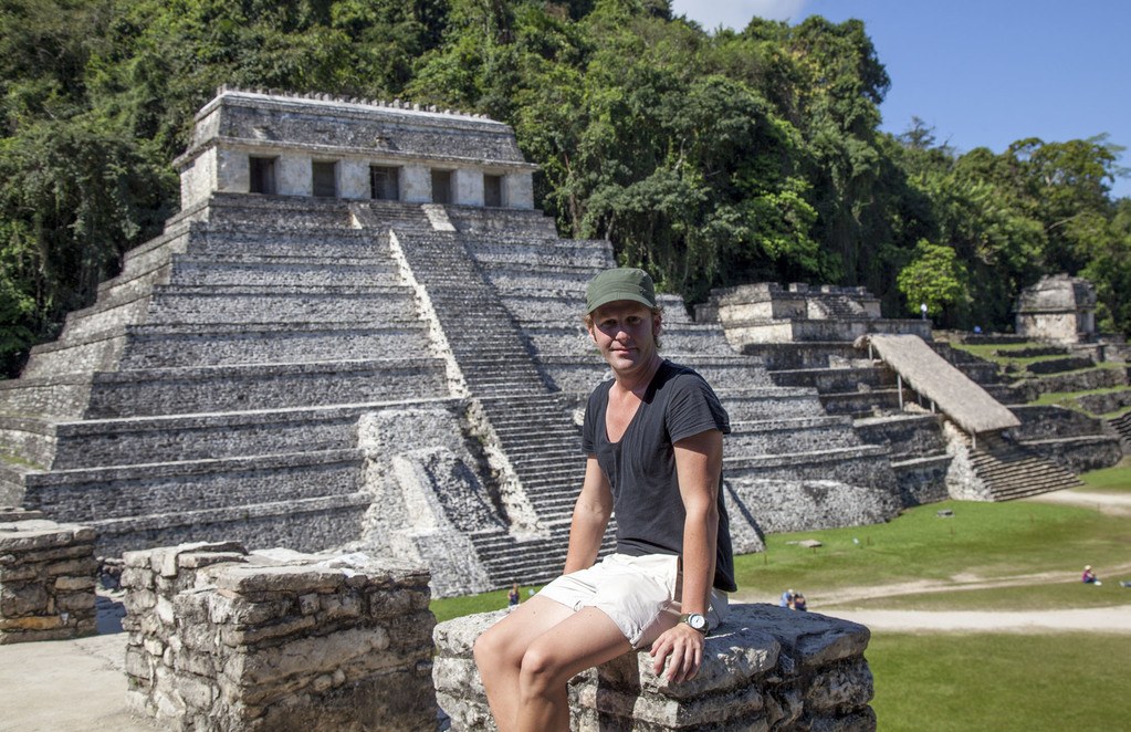 Ben sitting in front of Templo de las inscripciones at Palenque Mexico