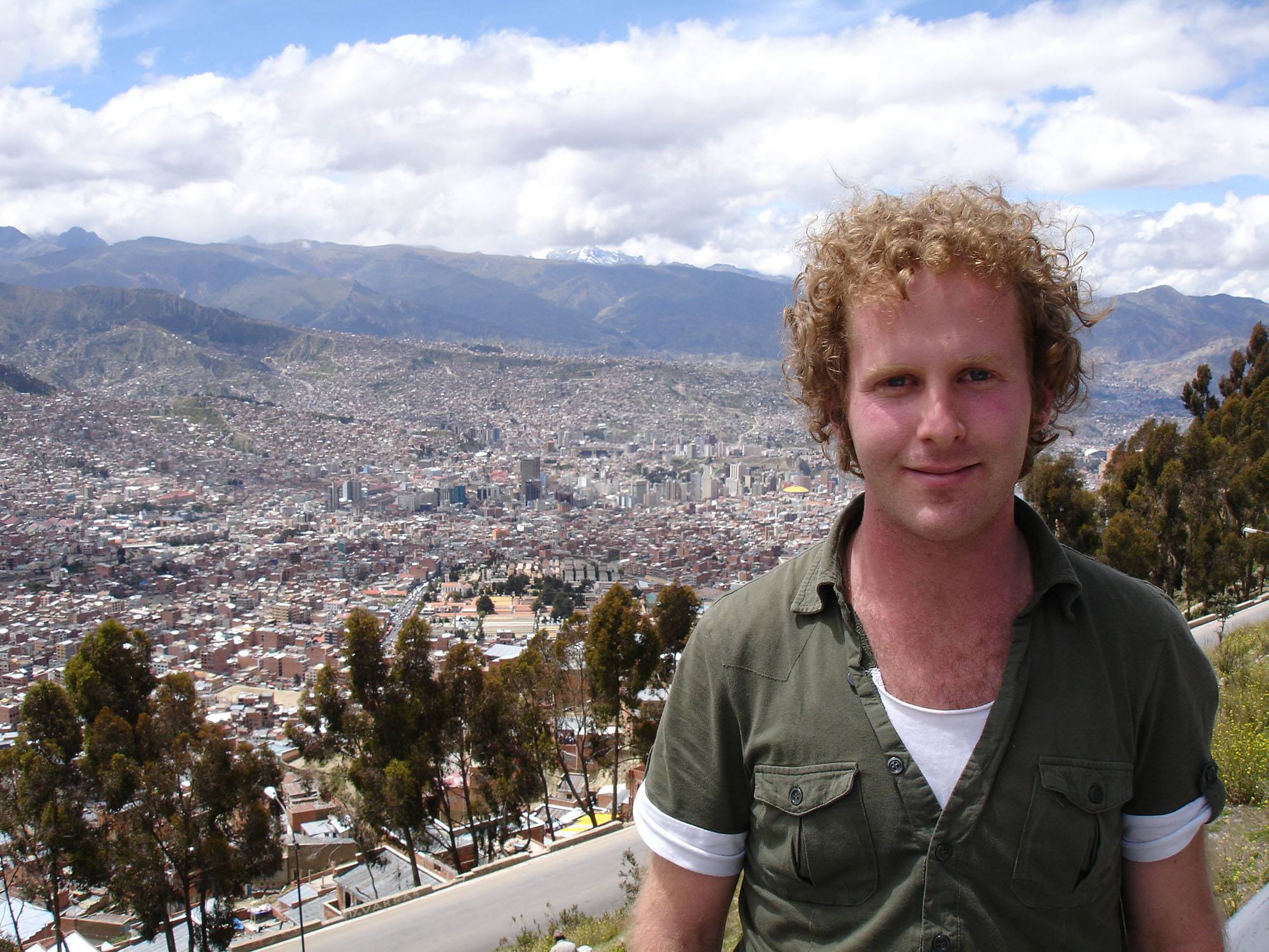 Ben standing before a panorama of La Paz Bolivia