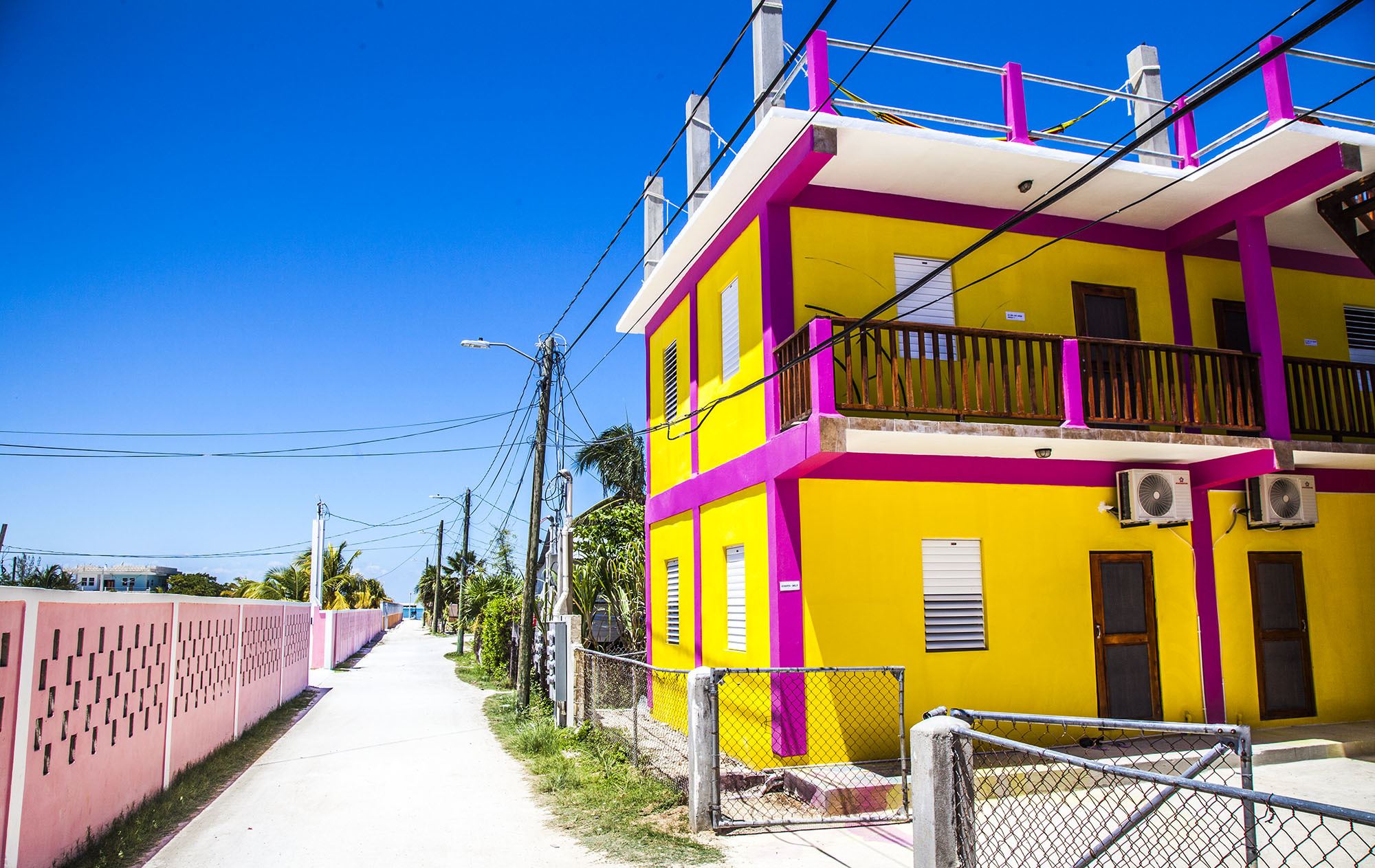 Bright yellow and pink house on Caye Caulker Belize