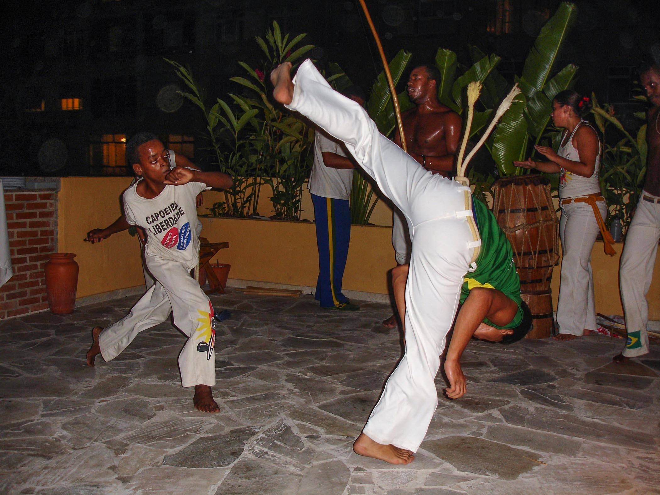 Capoeira performers on the roof terrace of Stone of a Beach Hostel in Rio de Janeiro Brazil