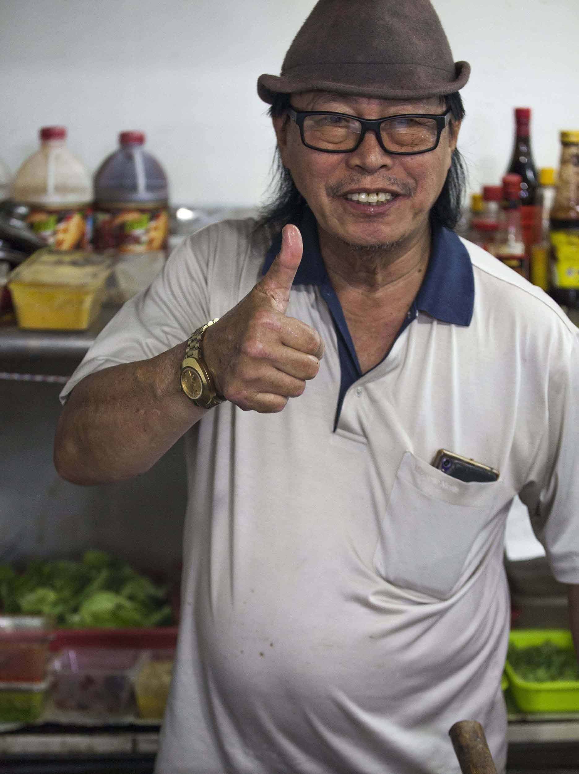 Cook at Tamu Selera night market in Bandar Seri Begawan Brunei