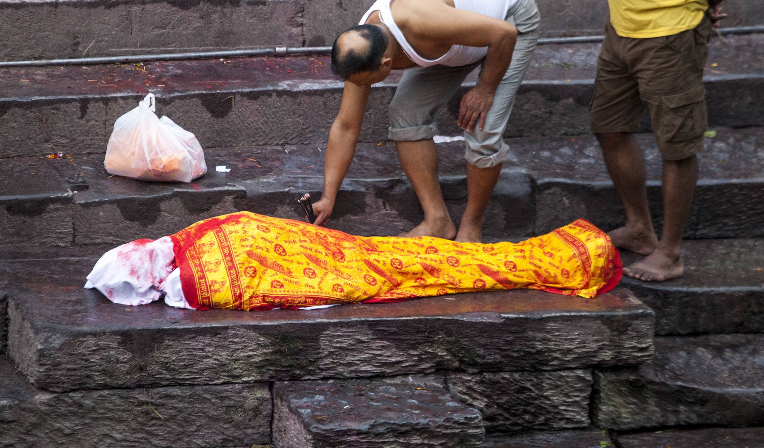 Corpse on the steps of Pashupatinath Temple in Kathmandu Nepal