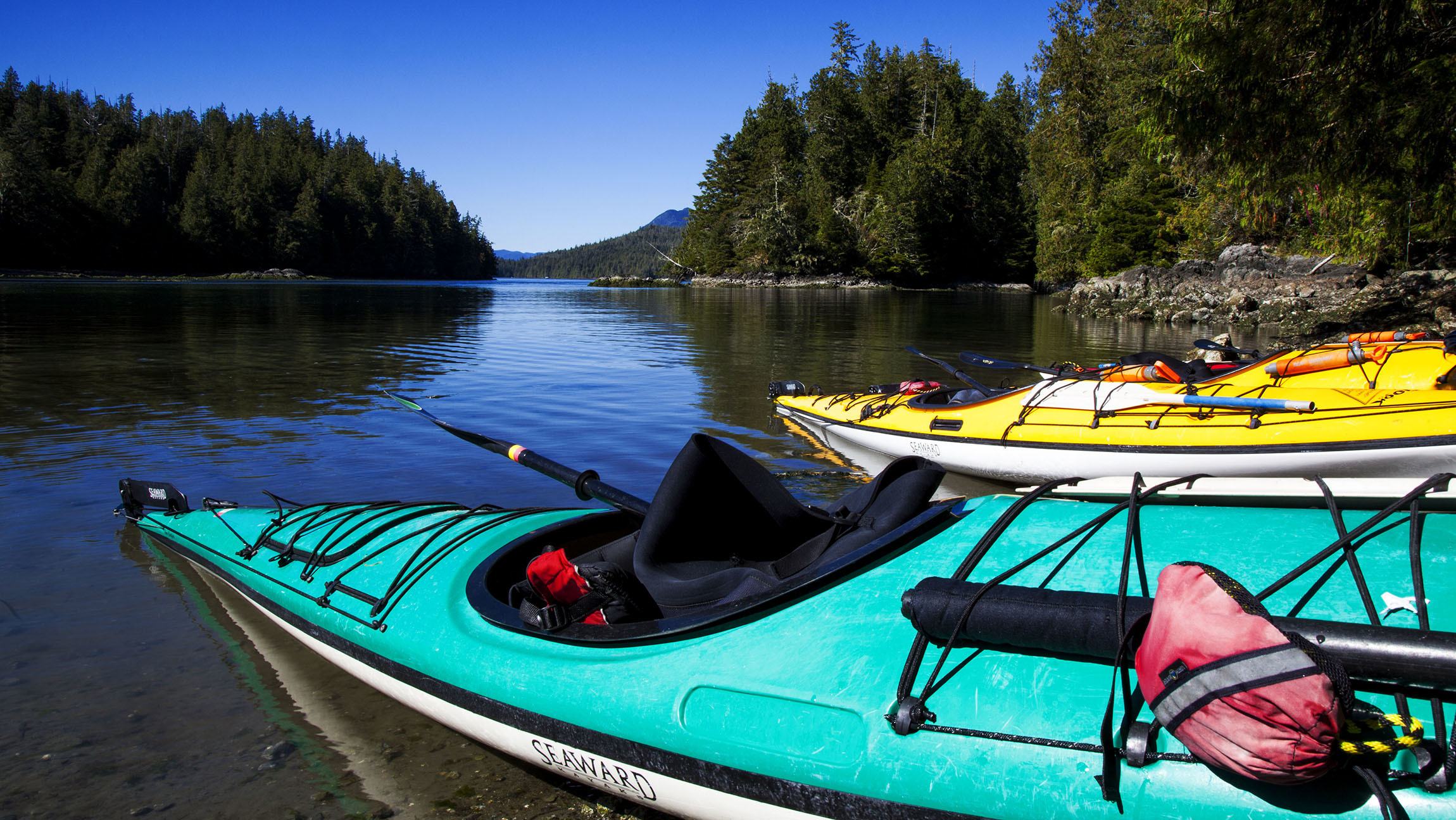 Kayaks in water on Meares Island Vancouver Island Canada