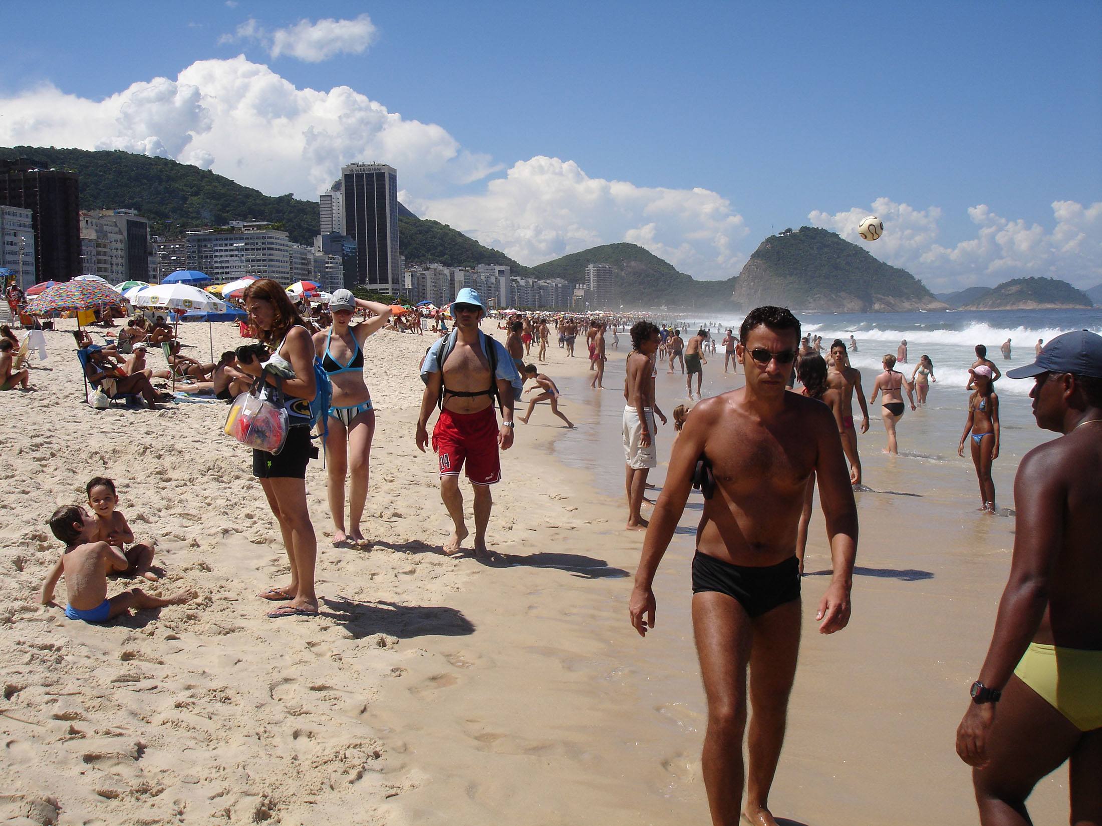 Man in speedos on Copacabana Beach Rio de Janeiro Brazil