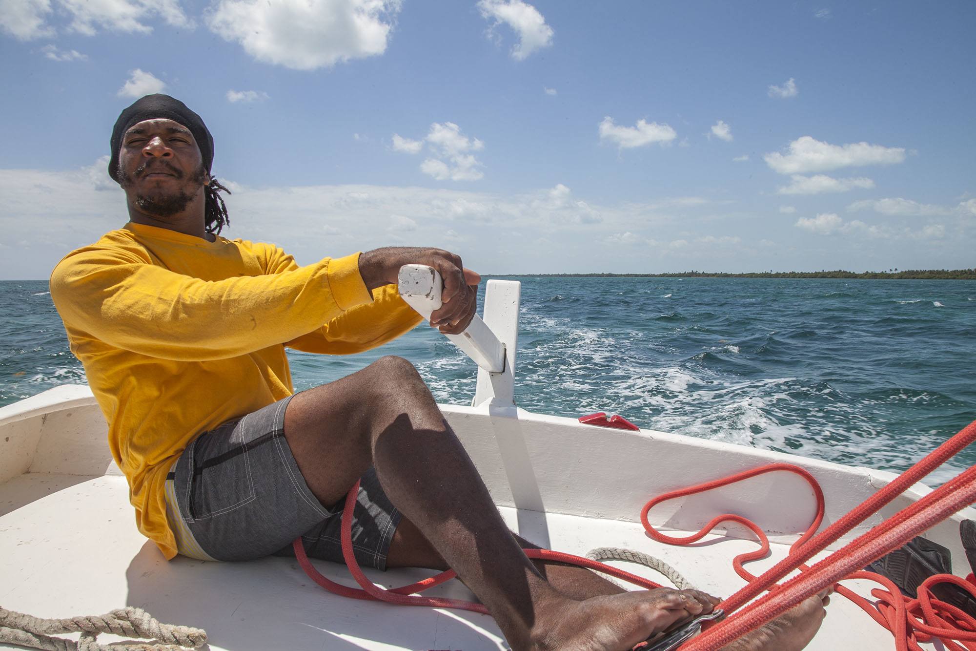 Rastafarian man on yacht near Caye Caulker Belize