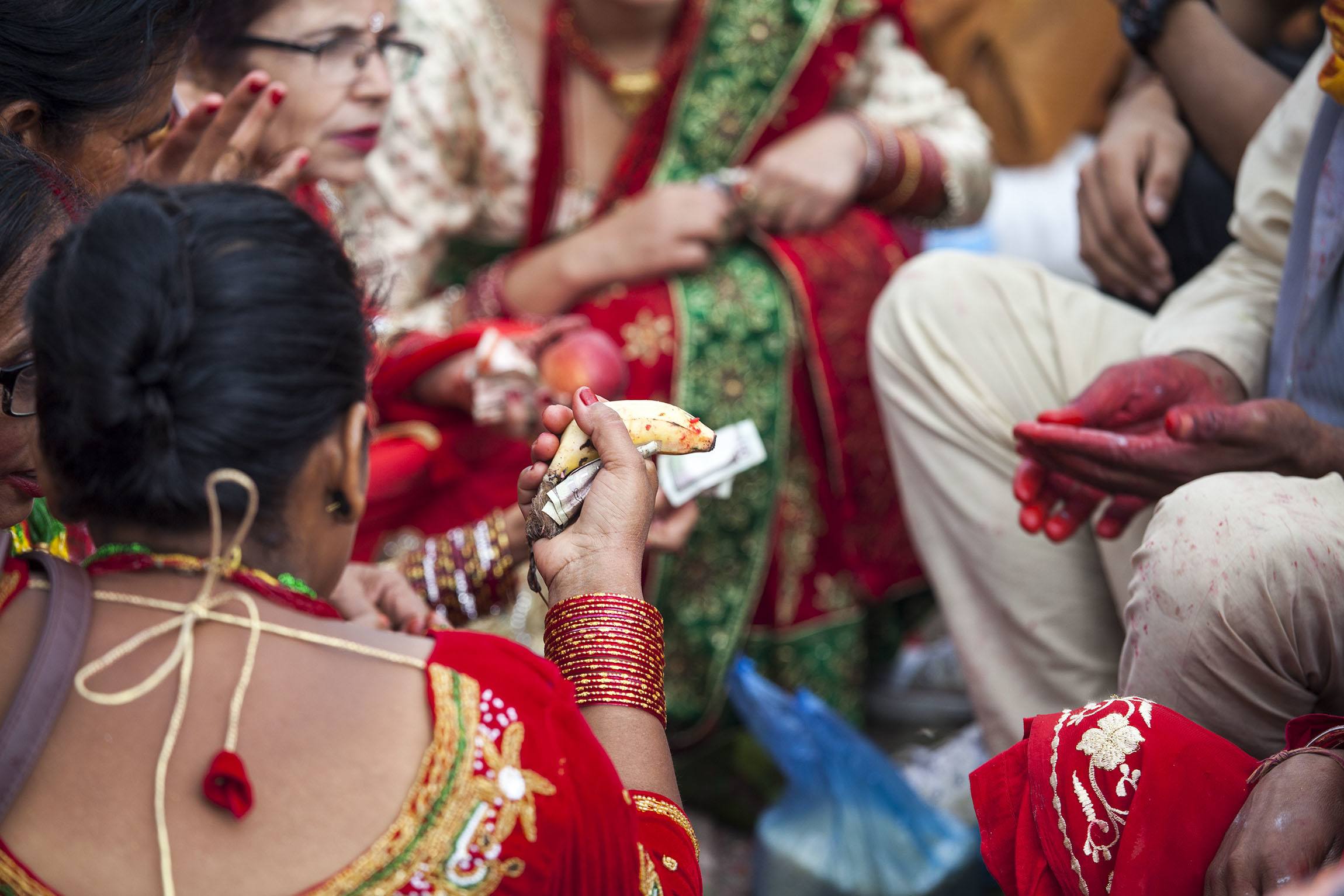 Woman holding banana at temple during Teej in Kathmandu Nepal