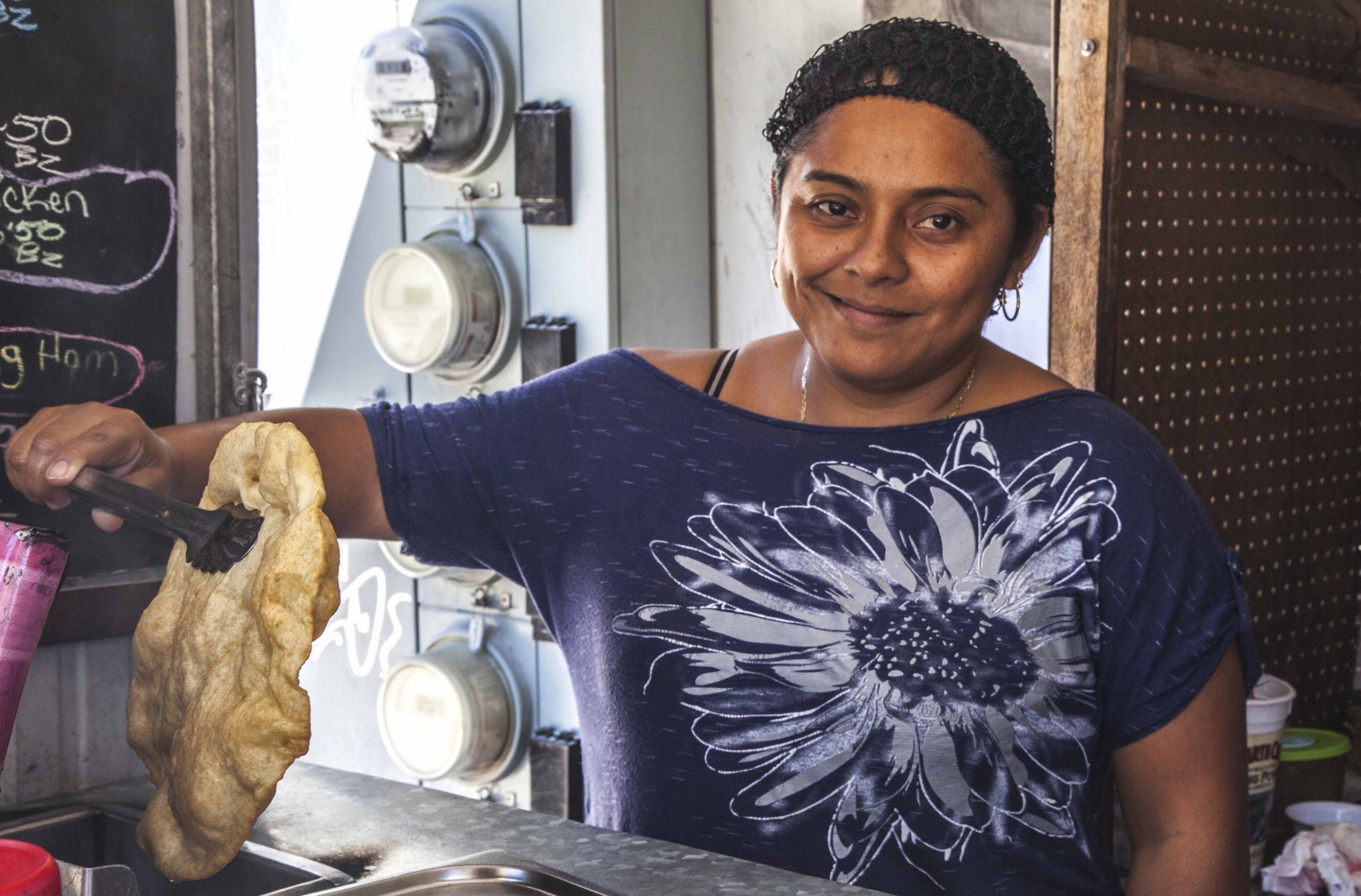 Woman making local food on Caye Caulker Belize