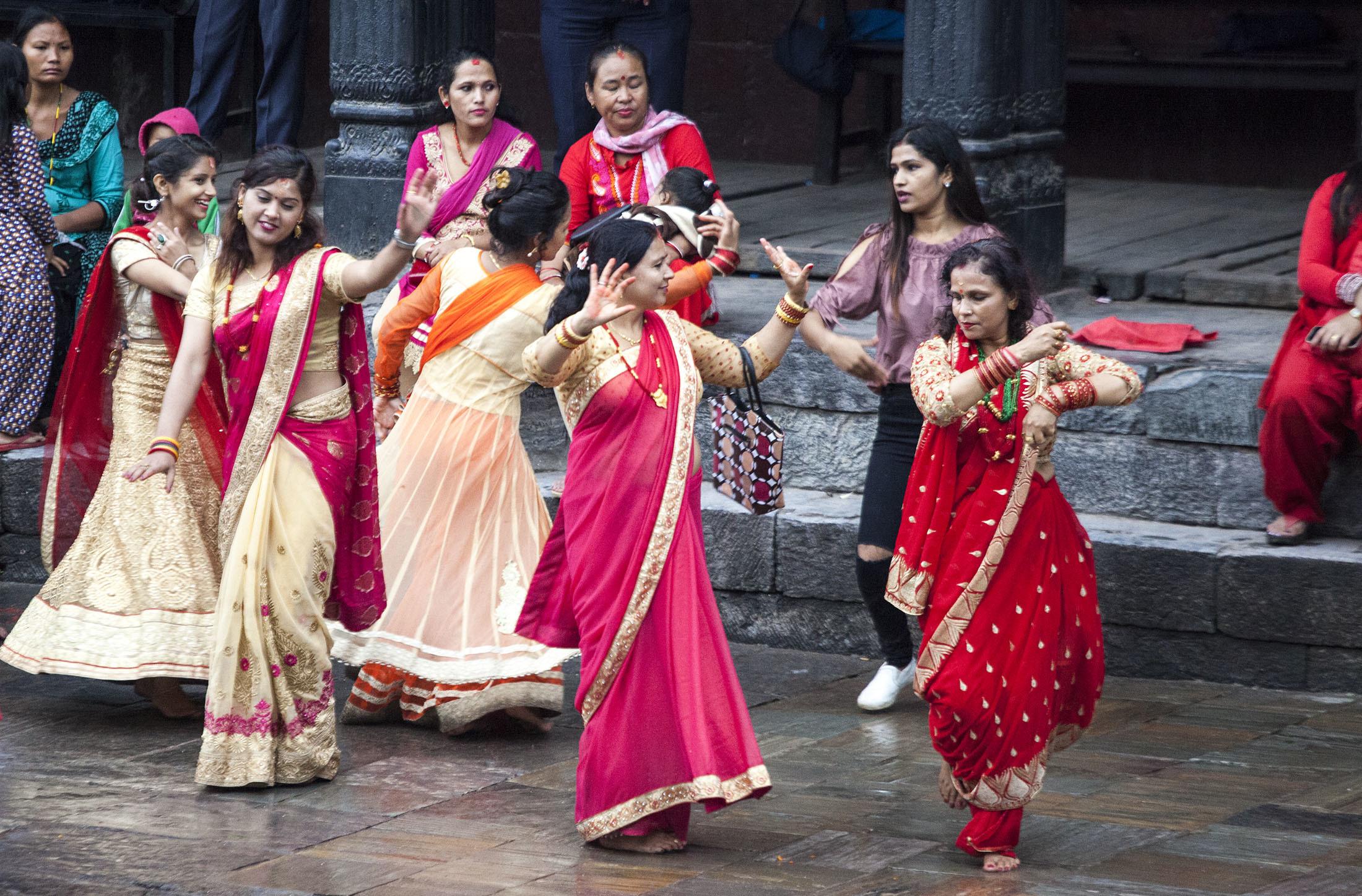 Women dancing at Pashupatinath Temple during Teej celebrations Kathmandu Nepal