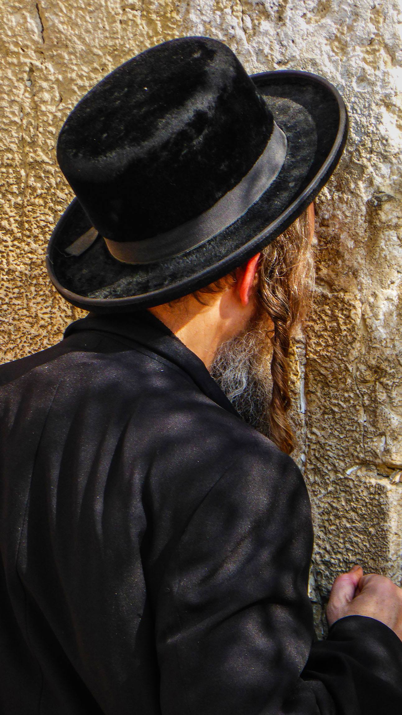 An Orthodox Jewish man at the Wailing Wall in Jerusalem Israel