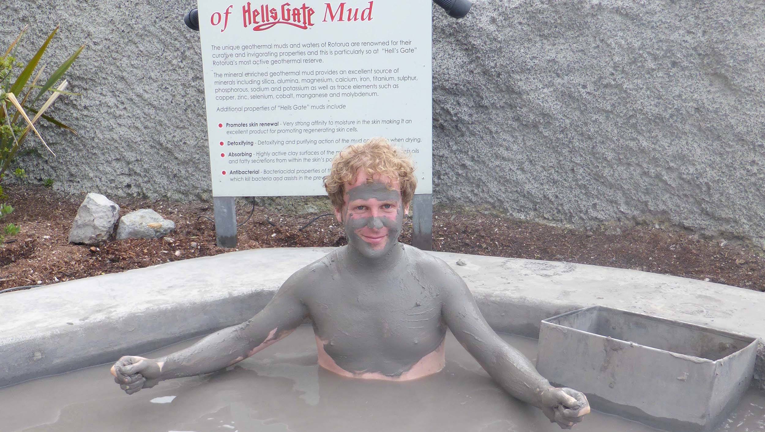 Ben covered in mud at Hellsgate Geothermal Park Rotorua North Island New Zealand