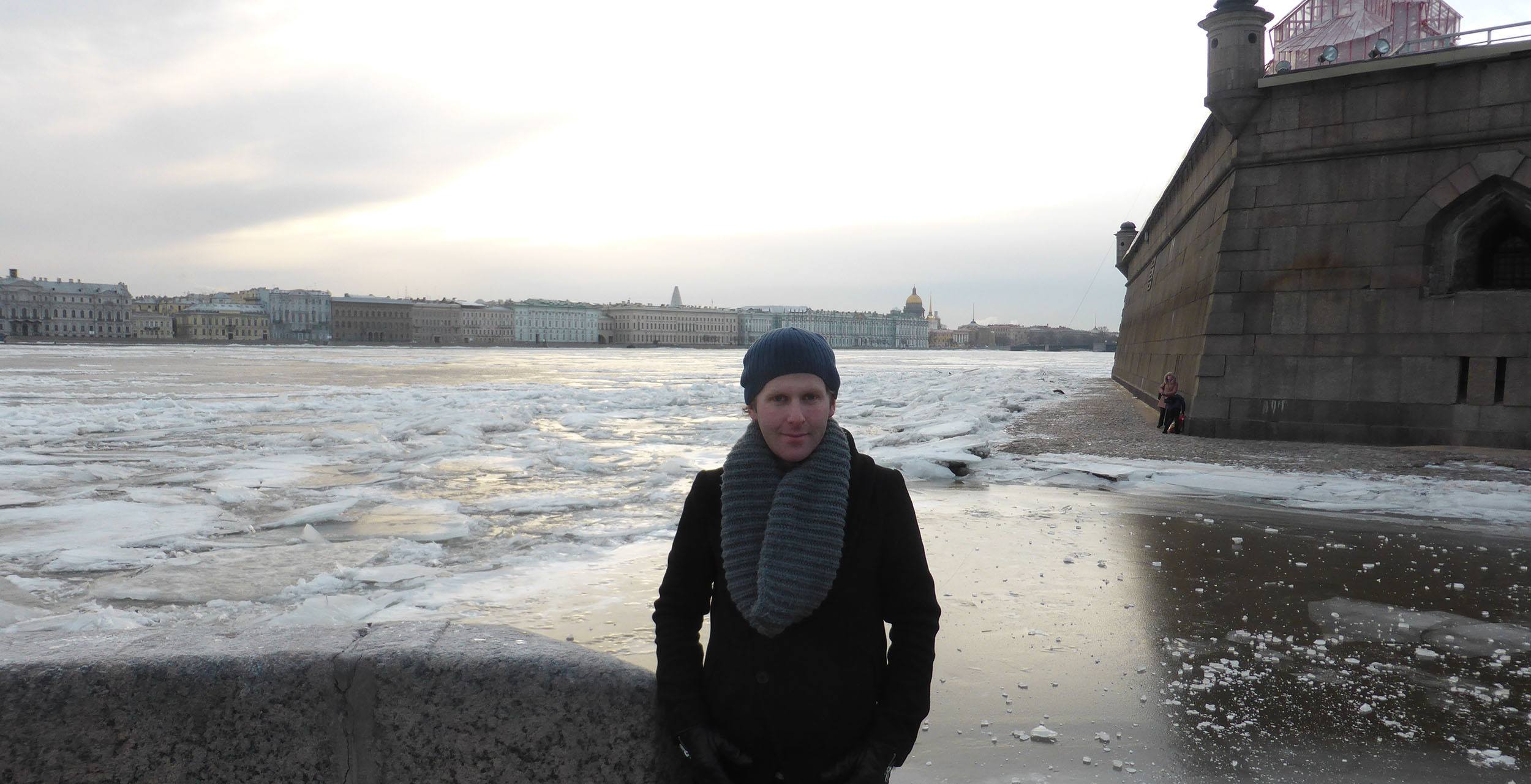 Ben posing beside body of water in Saint Petersburg Russia