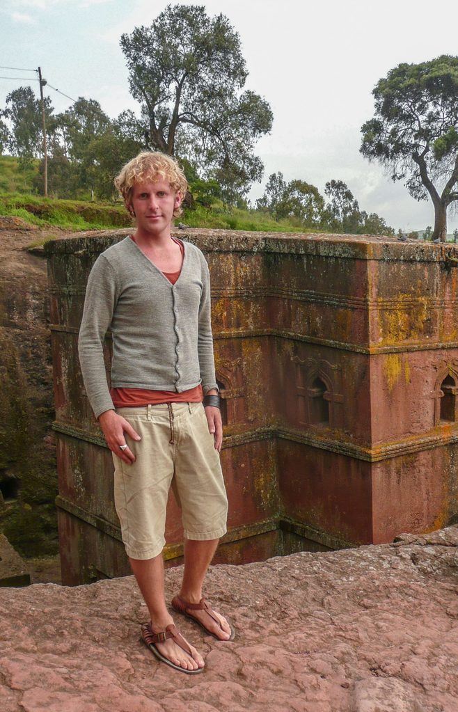 Ben standing in front of Church of St George in Lalibela Ethiopia