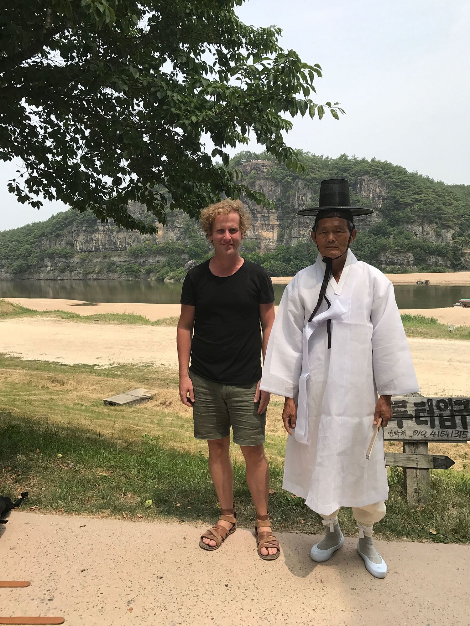 Ben with man dressed in traditional attire inside Hahoe Folk Village Republic of Korea