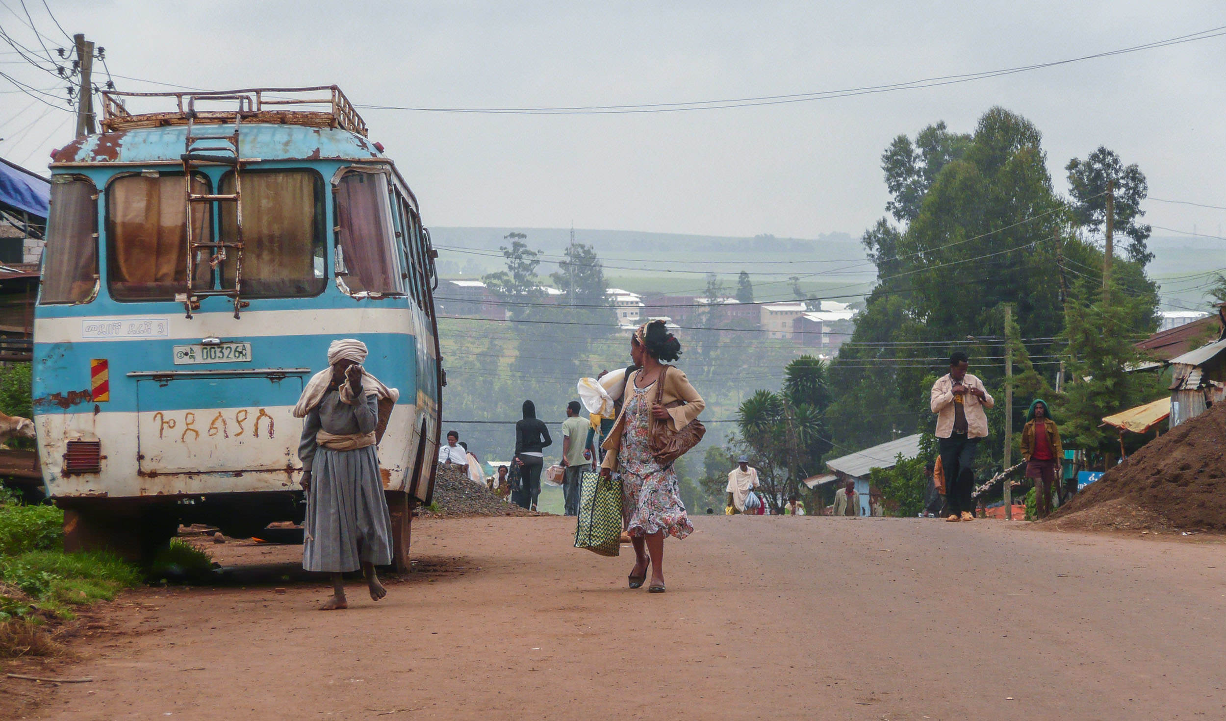 Blue bas parked on roadside in town near Bahir Dar Ethiopia