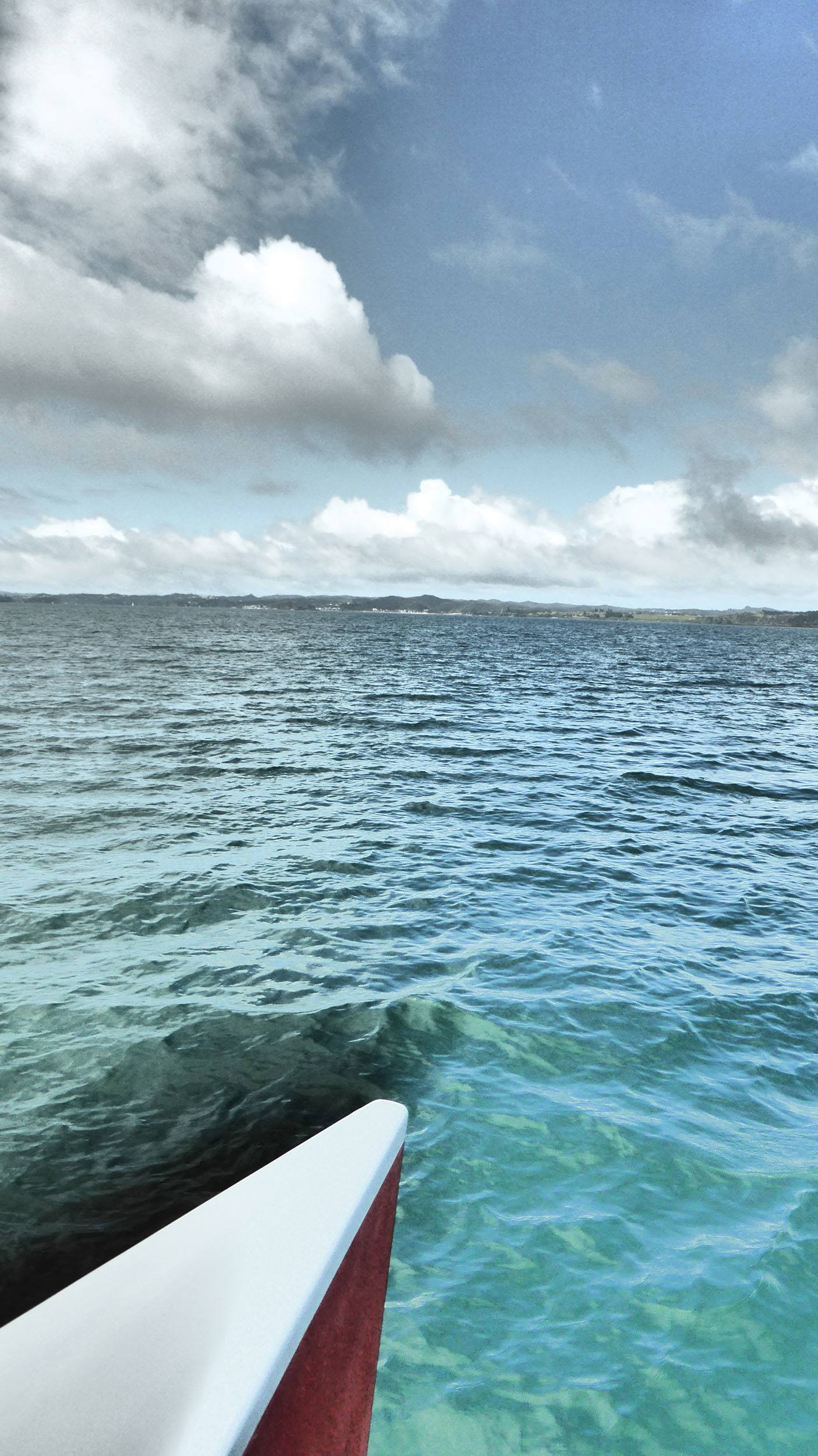 Front of catamaran sailing through Bay of Islands North Island New Zealand