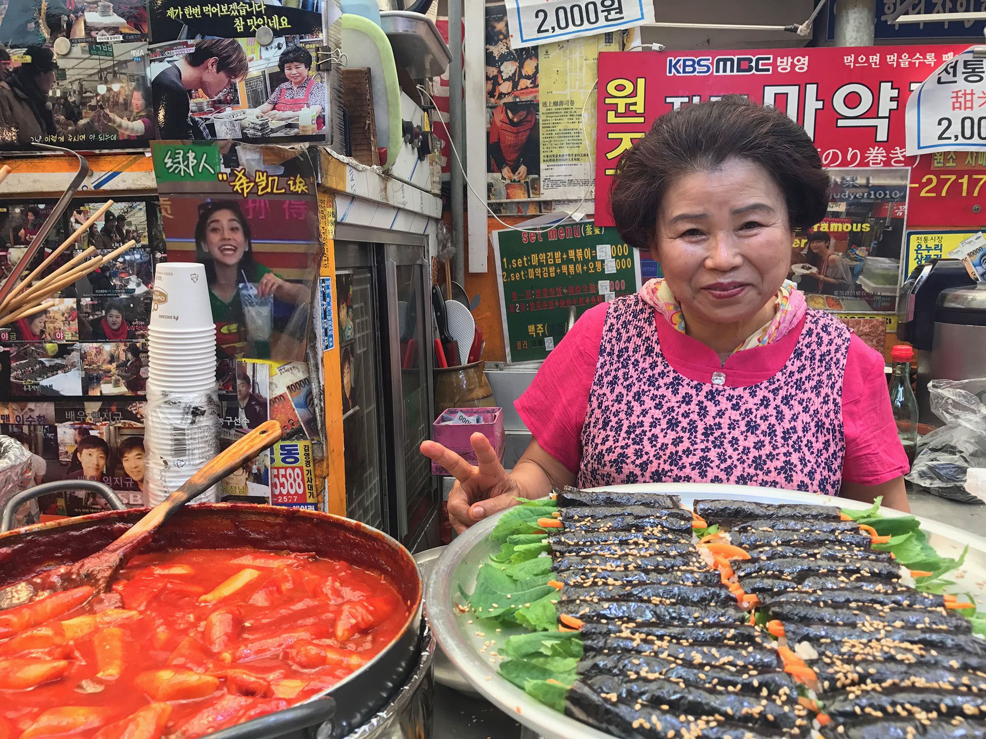 Korean woman behind food stall at Gwangjang Market Seoul Republic of Korea