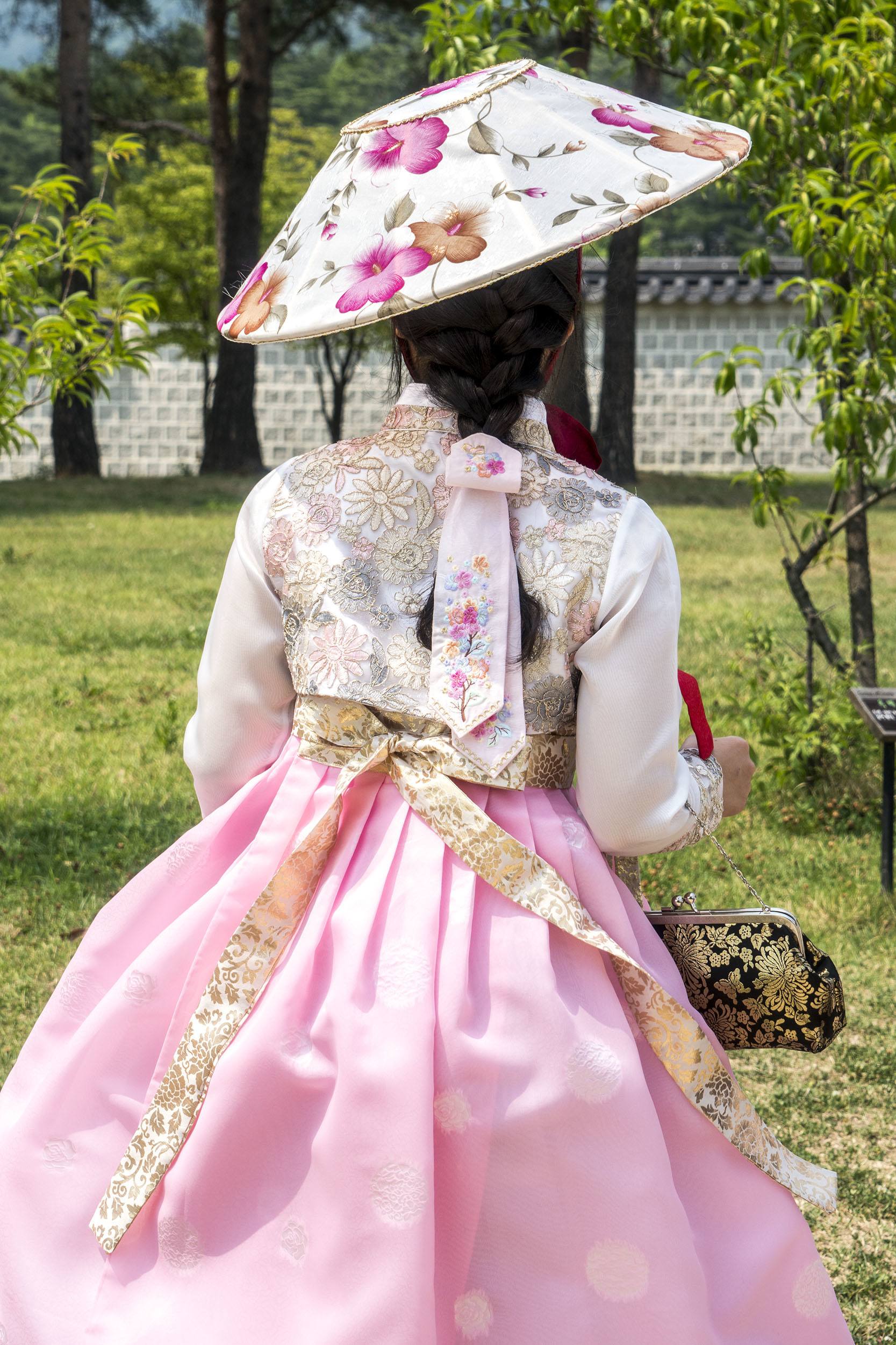 Korean woman in traditional attire at Gyeongbokgung Palace Seoul Republic of Korea