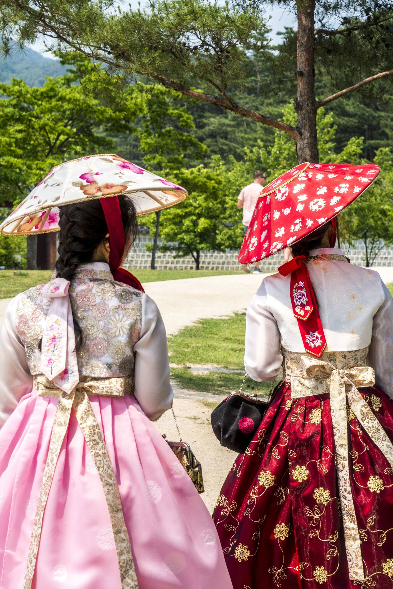Korean women in traditional attire at Gyeongbokgung Palace Seoul Republic of Korea