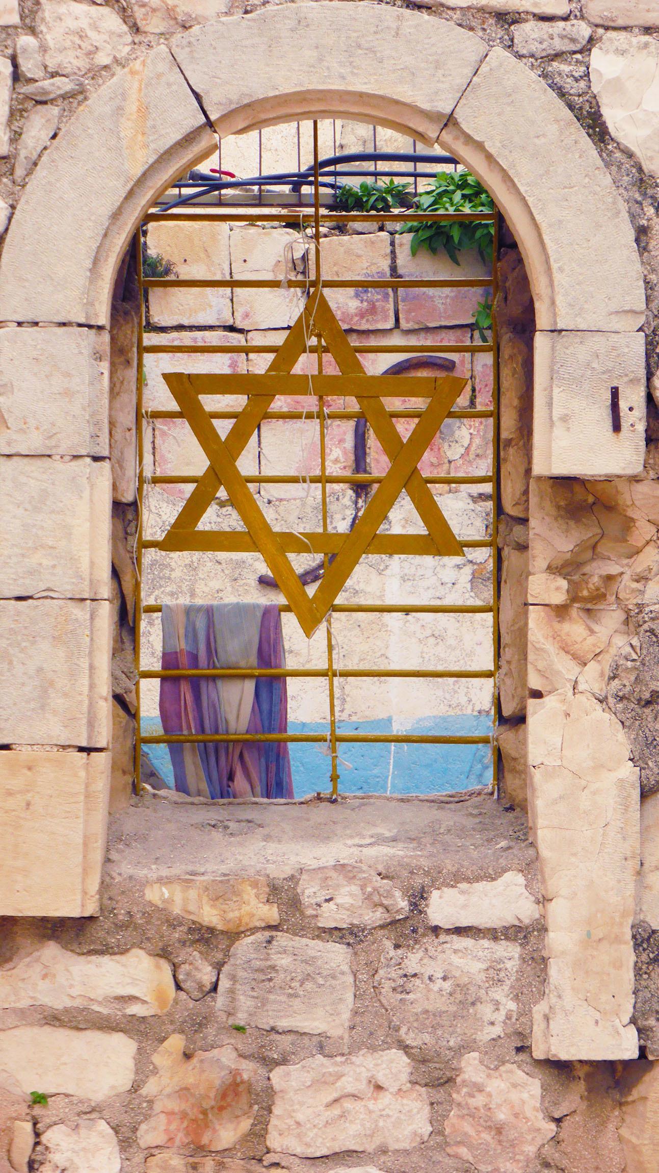 Star of David hanging on a fence in Jerusalem Israel