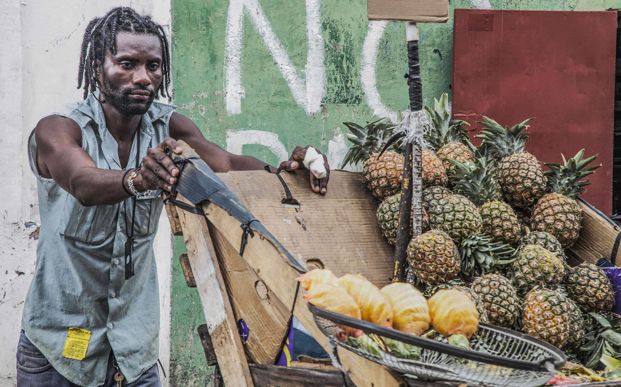 A Haitian immigrant selling pineapples in Santo Domingo Dominican Republic