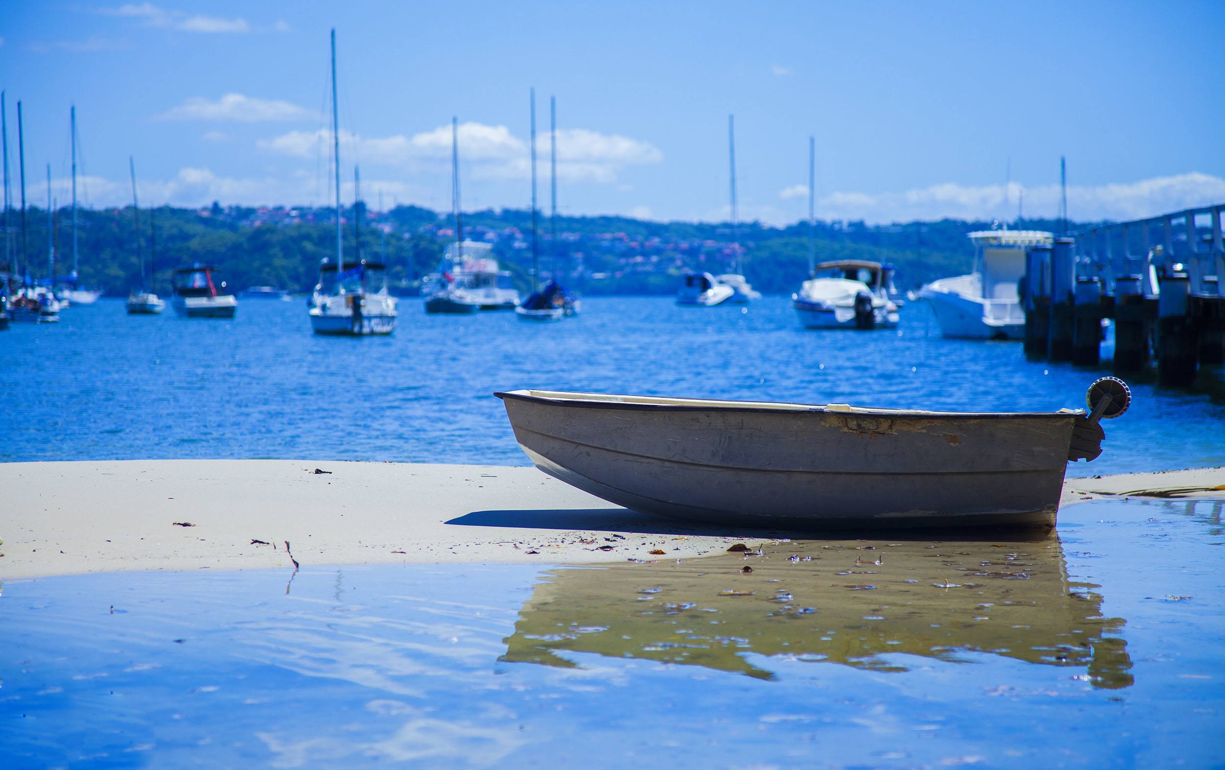 A boat on sand in Double Bay in Sydney Australia