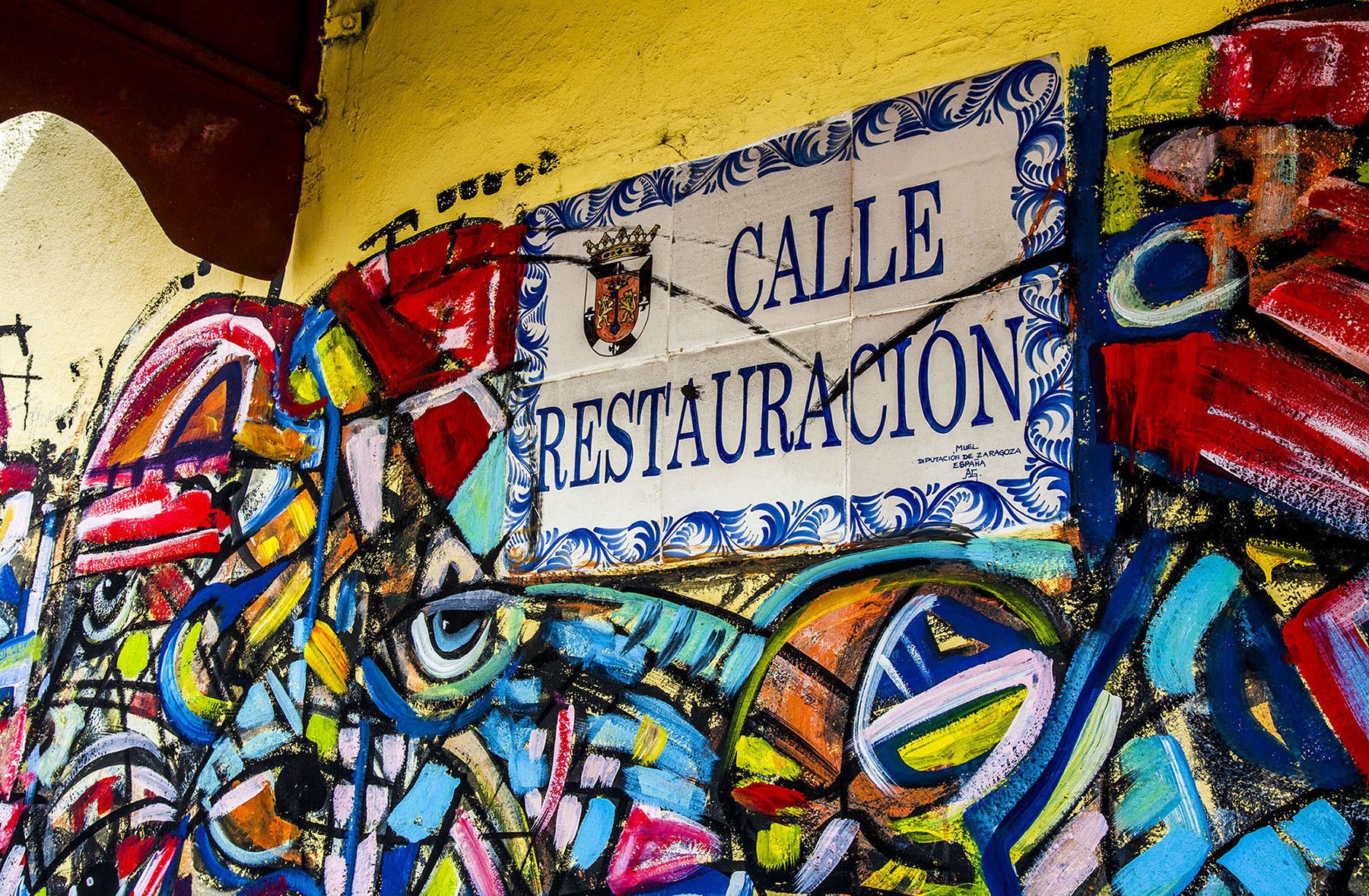 A colourful wall and street sign along Calle Restauracion Santo Domingo Dominican Republic