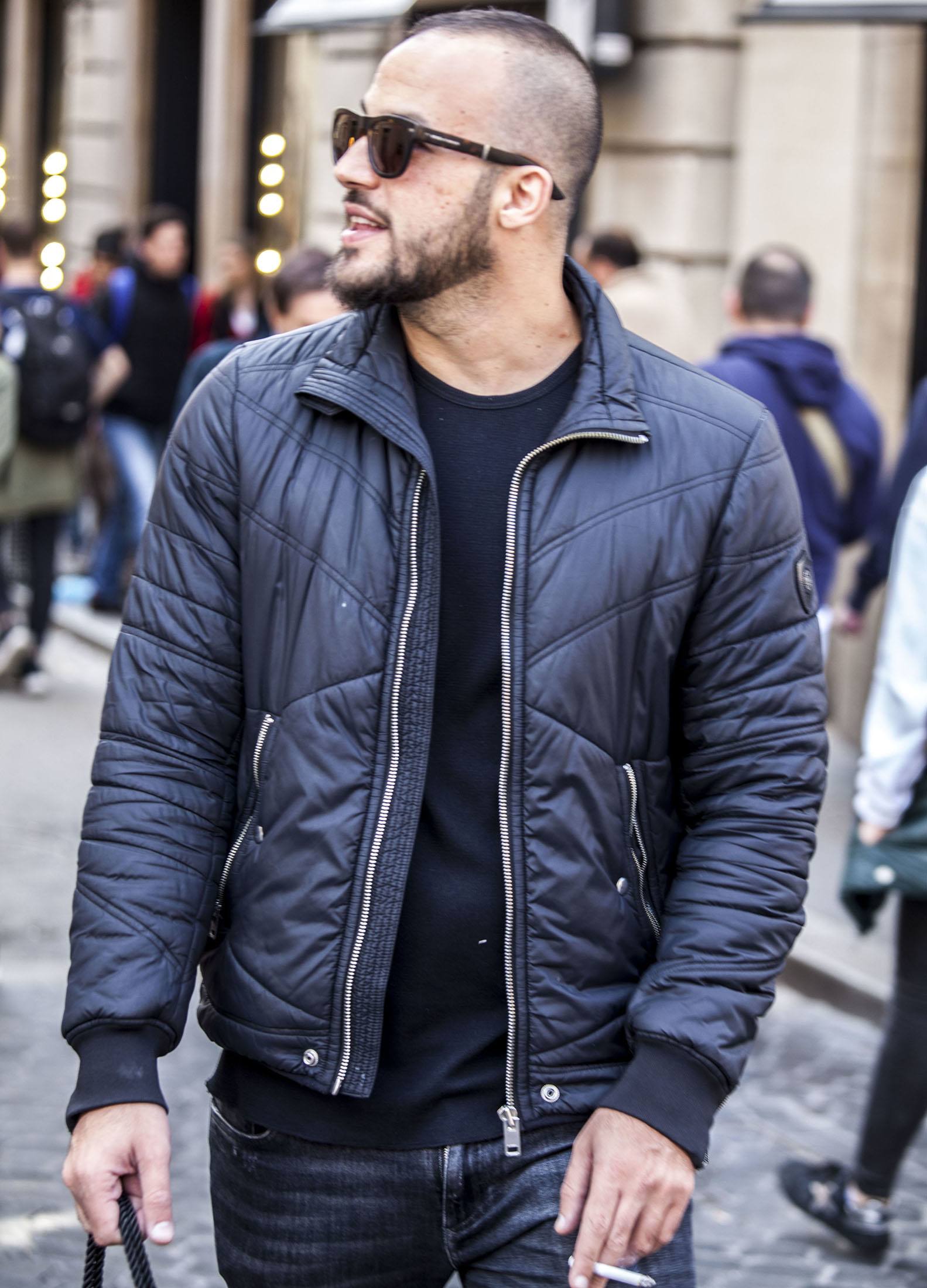 A handsome Italian man walking towards Piazza di Spagna in Rome Italy