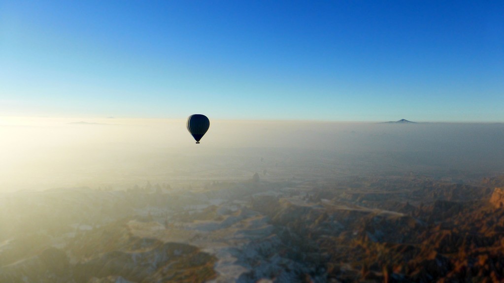 A hot air balloon flying over Cappadocia Turkey