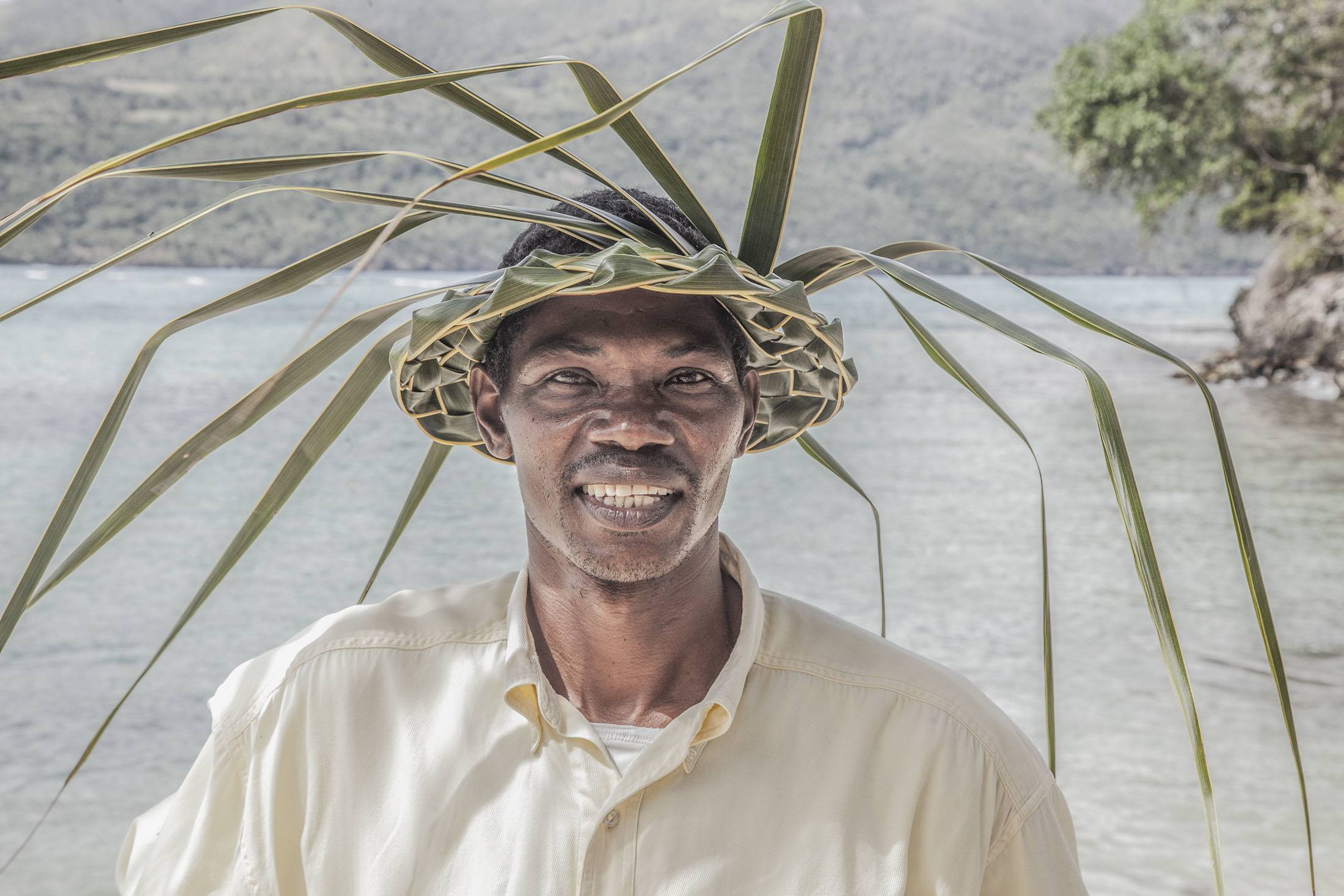 A man wearing a hat made of leaves on Playa Rincon Dominican Republic