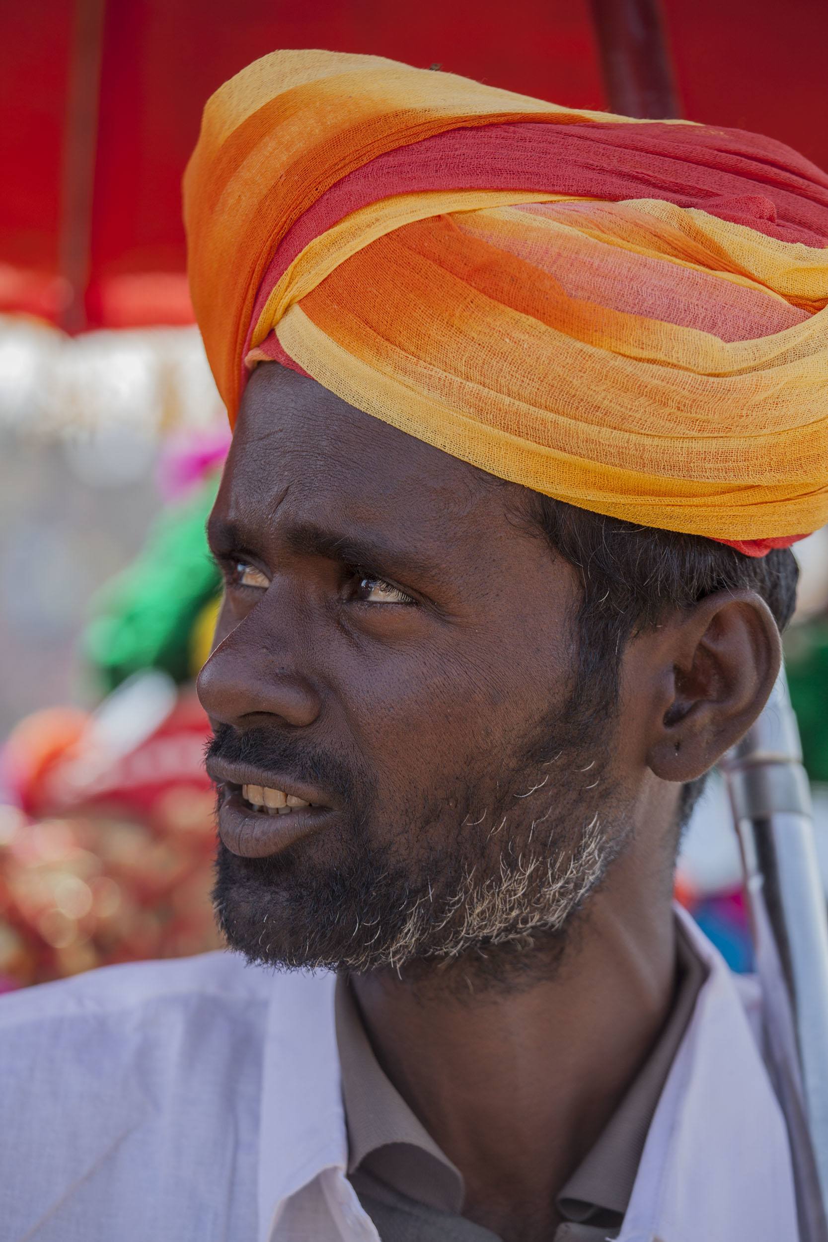 An Indian man in a colourful turban in Jaisalmer India