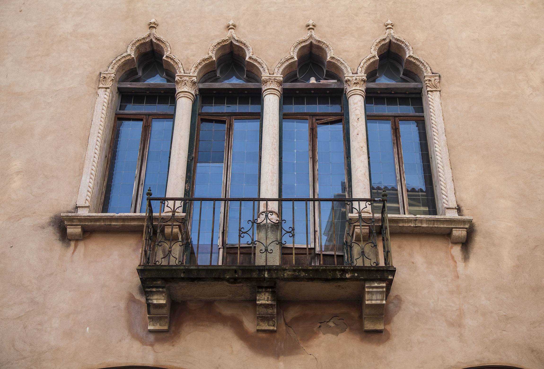 Beautiful windows and balcony attached to a building in Padova Italy