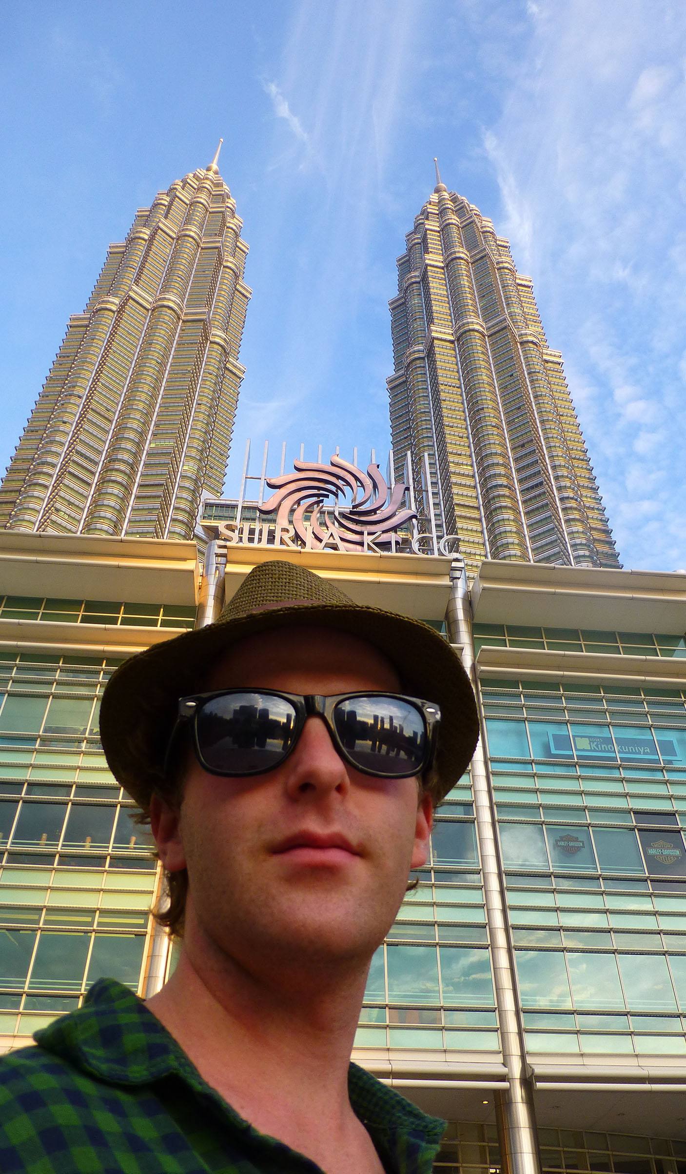 Ben outside Petronas Towers in Kuala Lumpur Malaysia