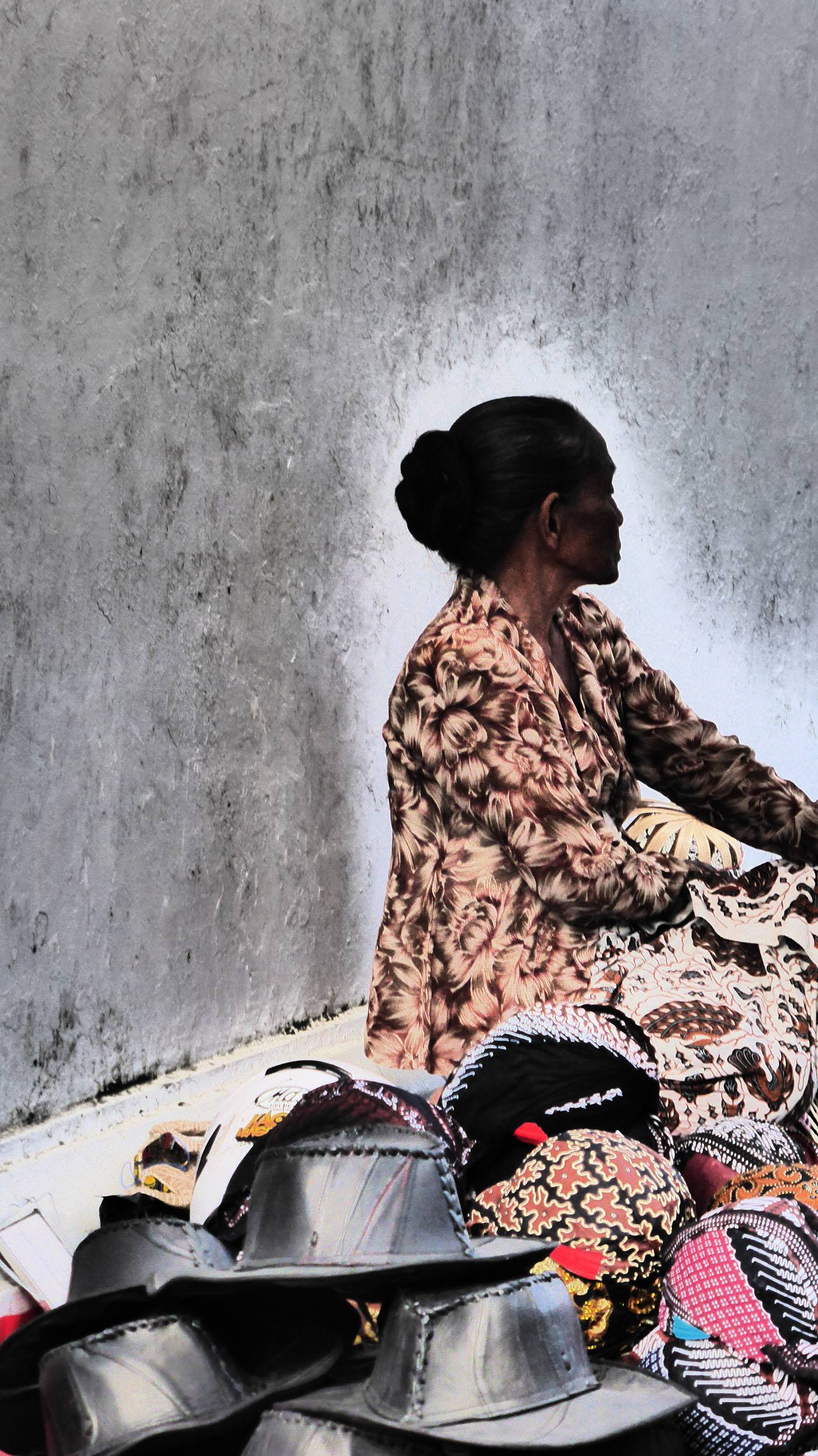 Indonesian woman selling hats on the streets of Yogyakarta Indonesia