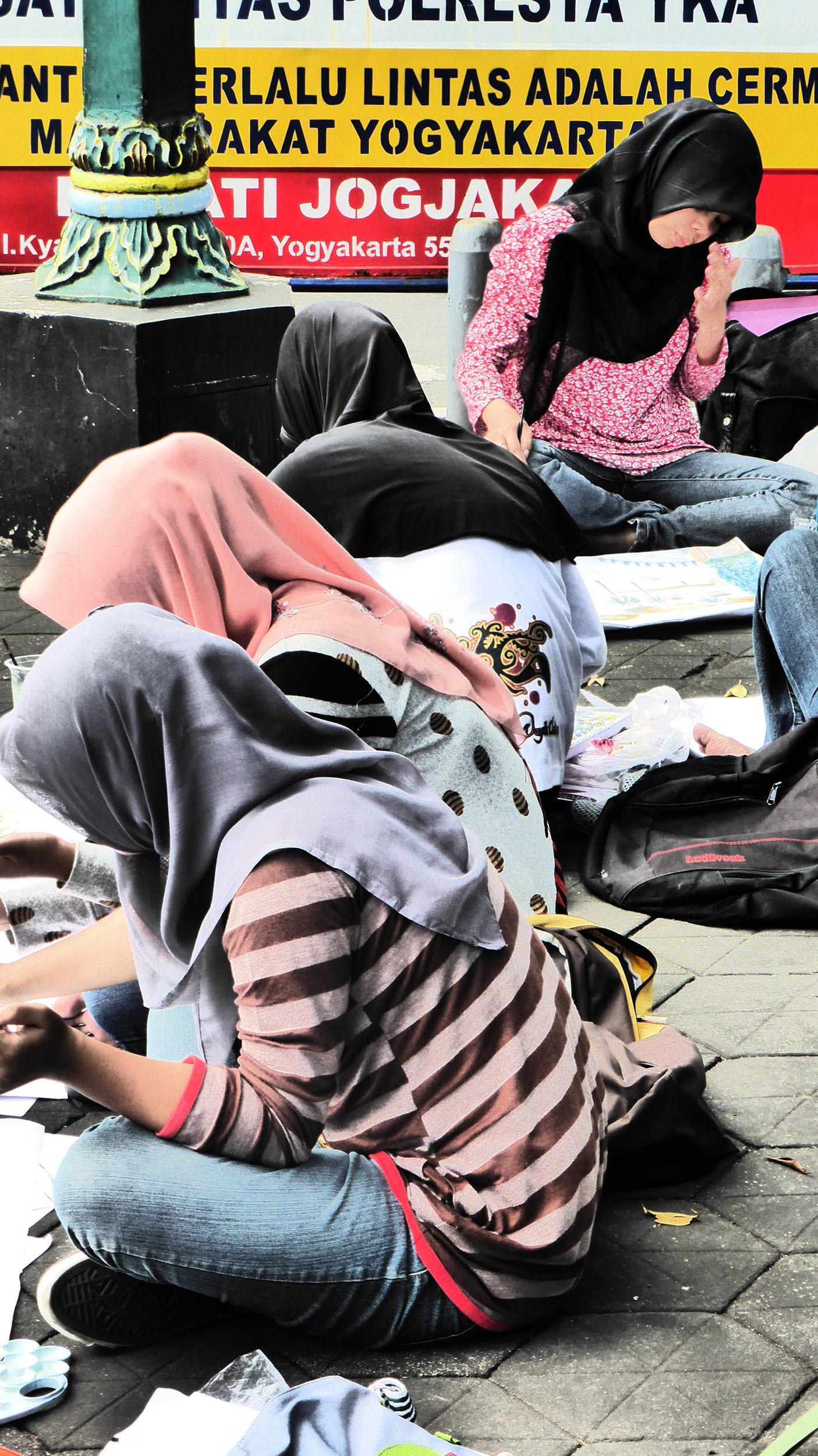 Indonesians resting in the streets of Yogyakarta Indonesia