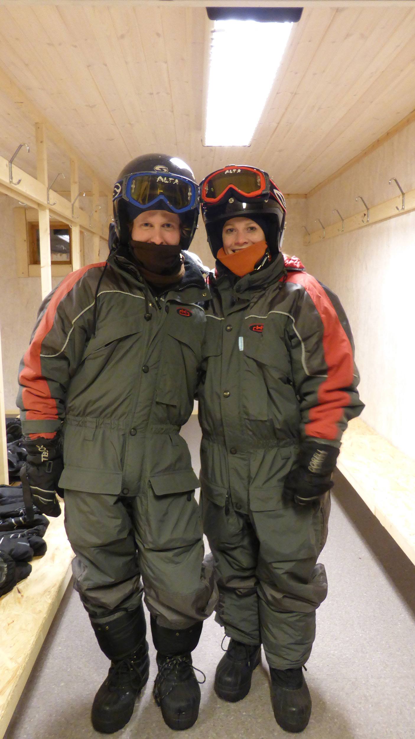 Kylie and Ben dressing in snowsuits in the dressing room at Camp Alta Sweden