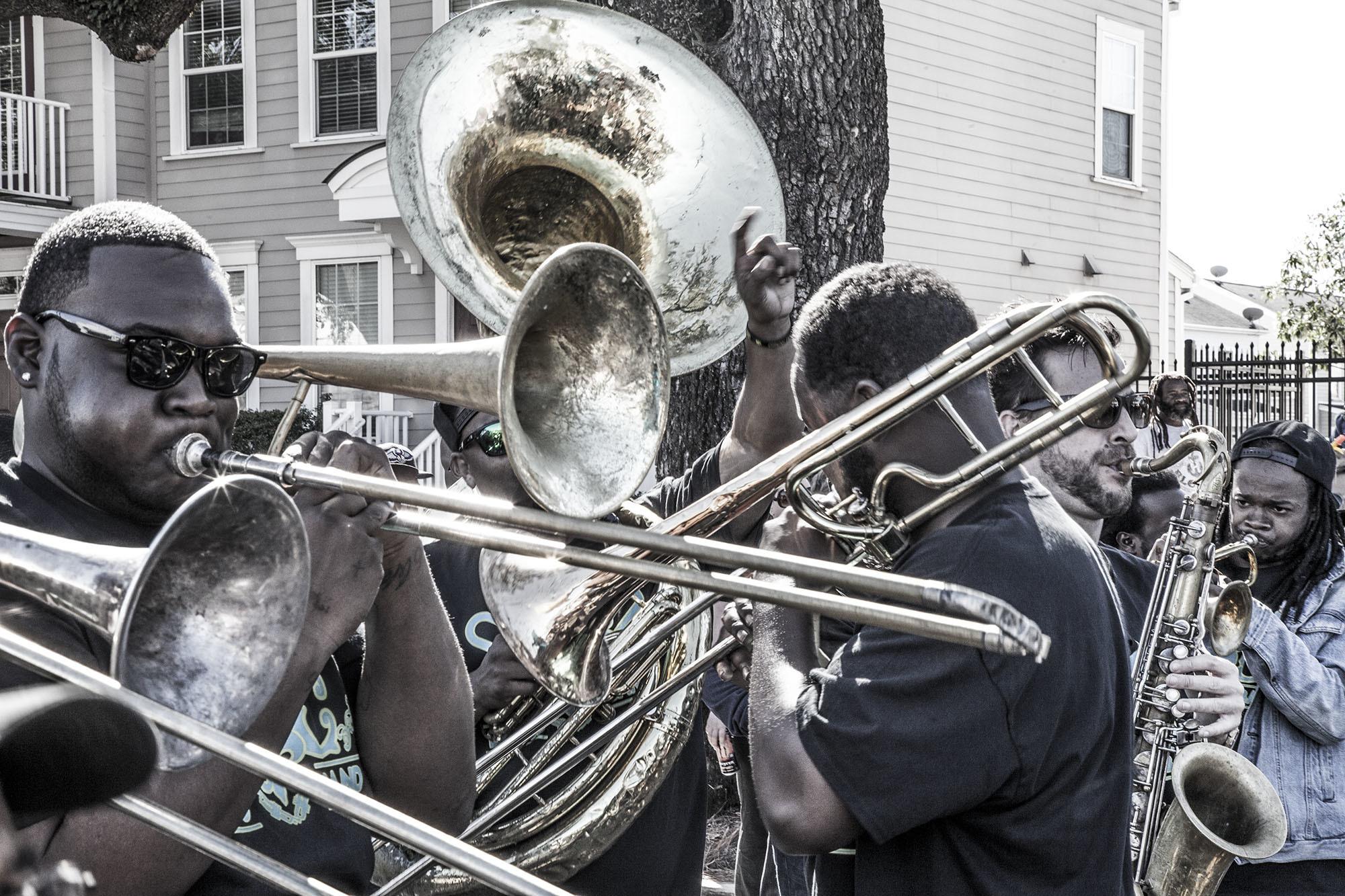 Marching band playing along Martin Luther King Jr. Boulevard in New Orleans USA