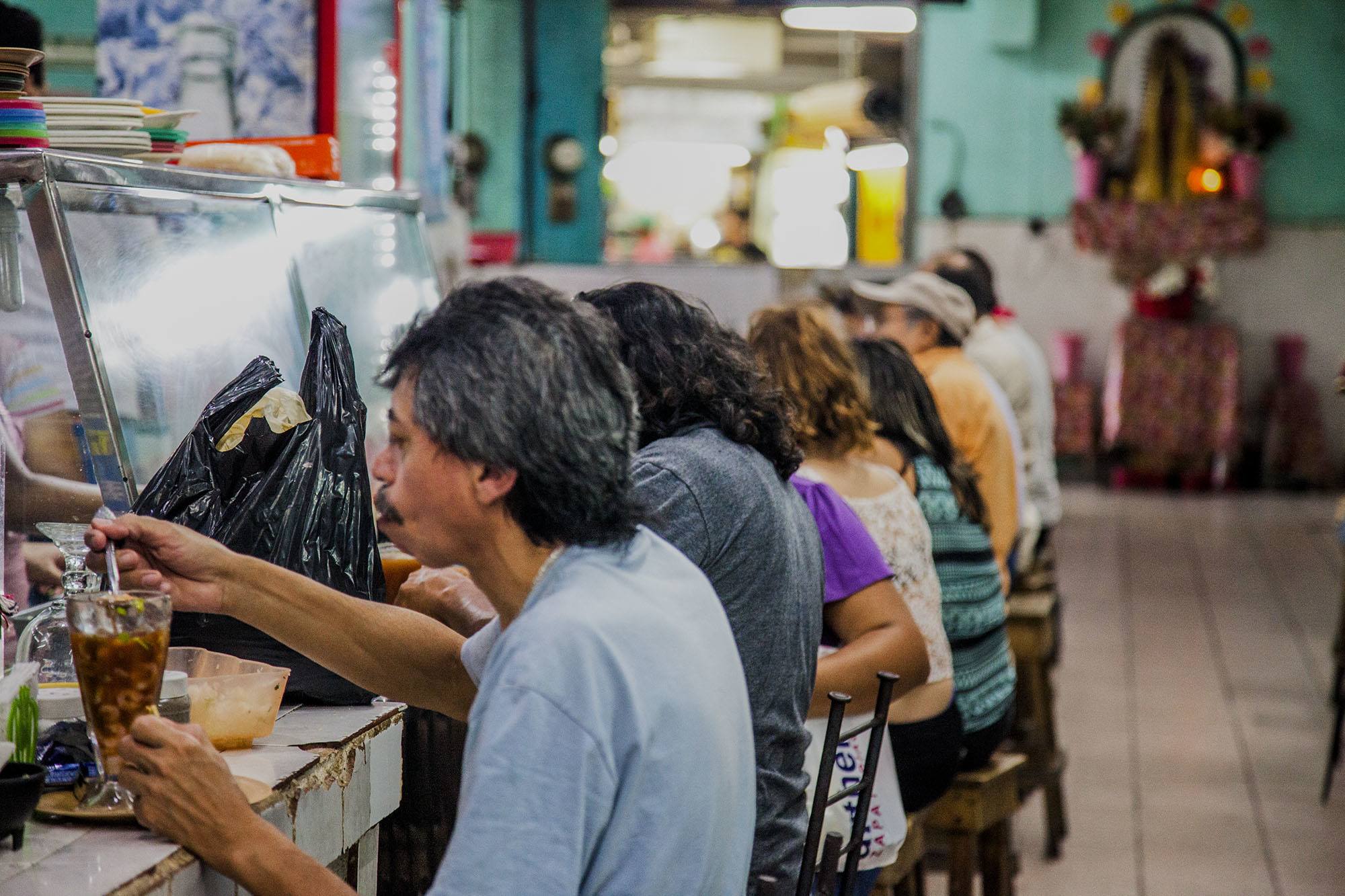 People eating at a market in Merida Mexico