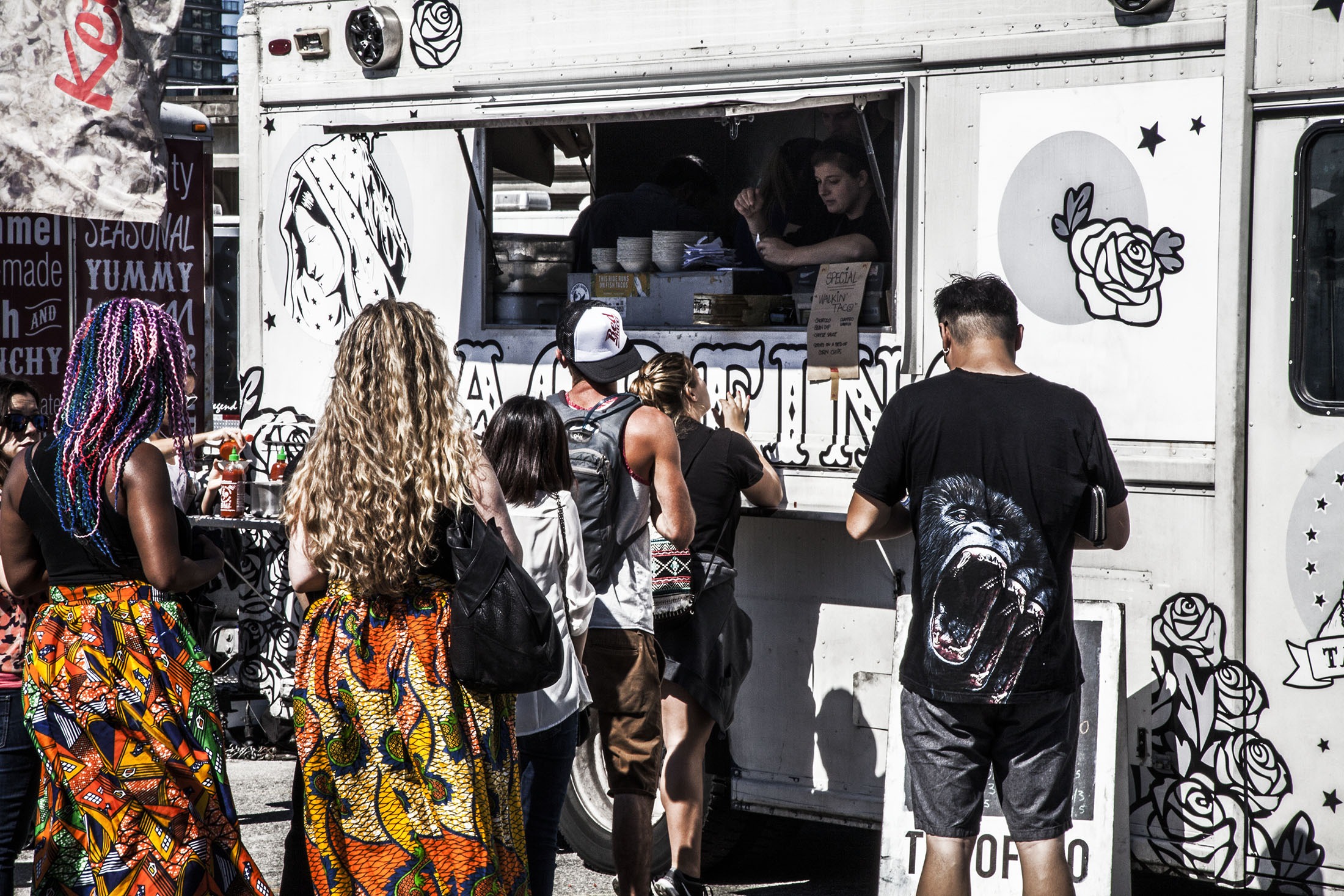 People lining up at a food truck in Vancouver Canada