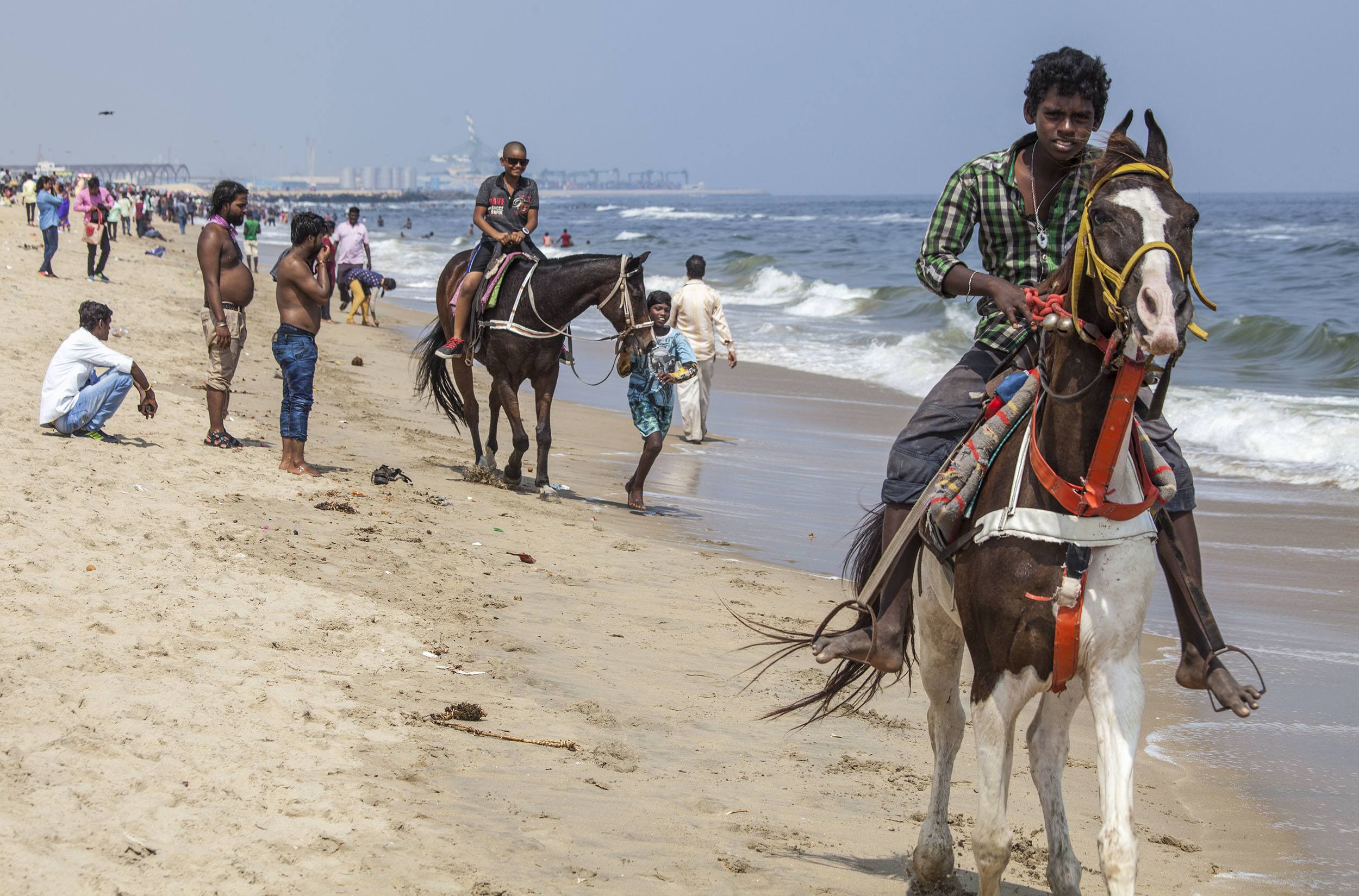 Riding horses along the beach in Chennai India