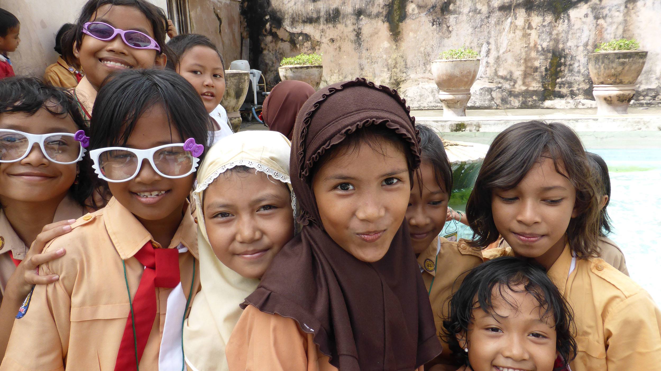 School girls posing for a photo inside Taman Sari in Yogyakarta Indonesia