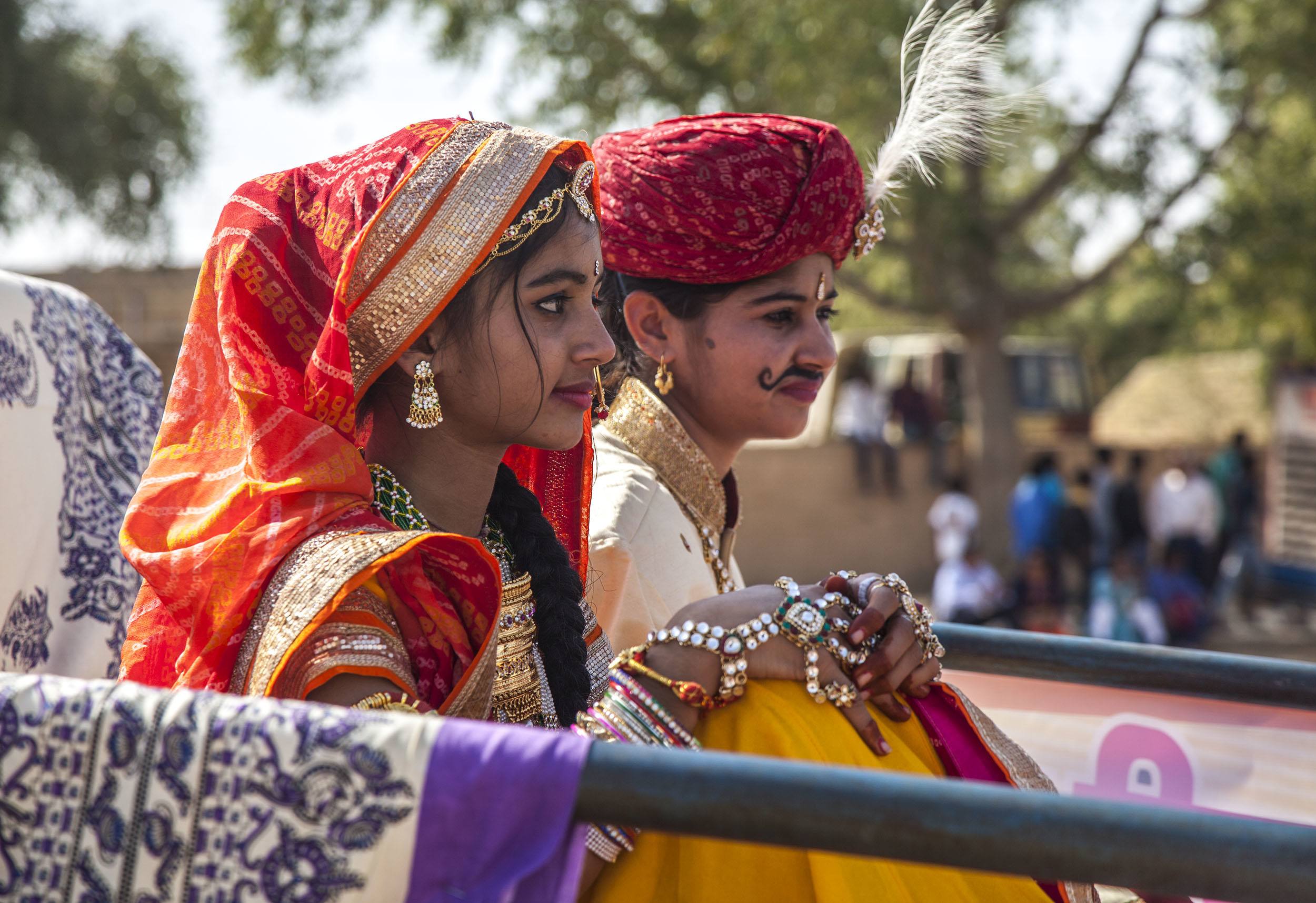 Two Indian women on a float at the Jaisalmer Desert Festival in India