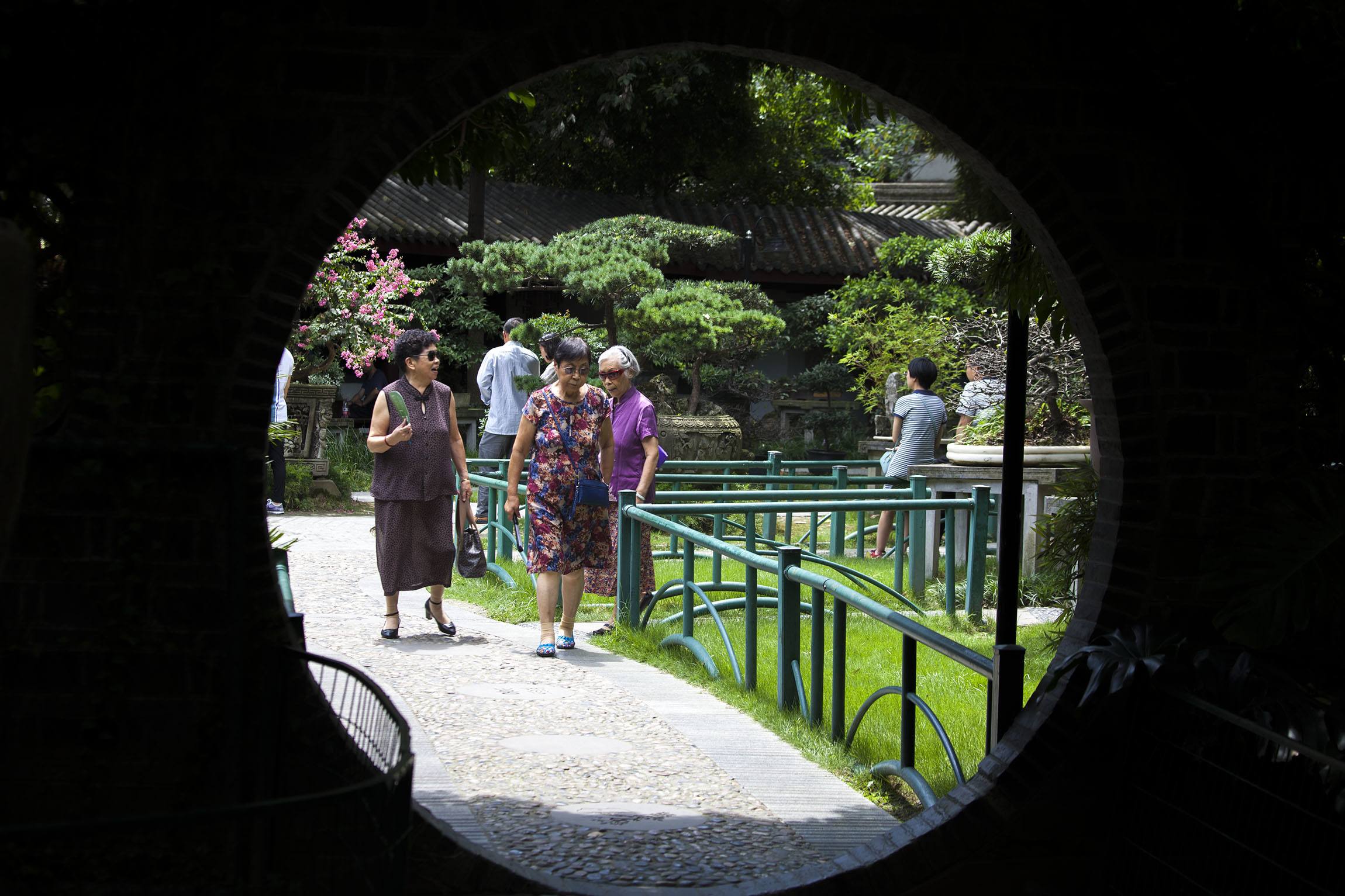 Women walking through garden in Chengdu China