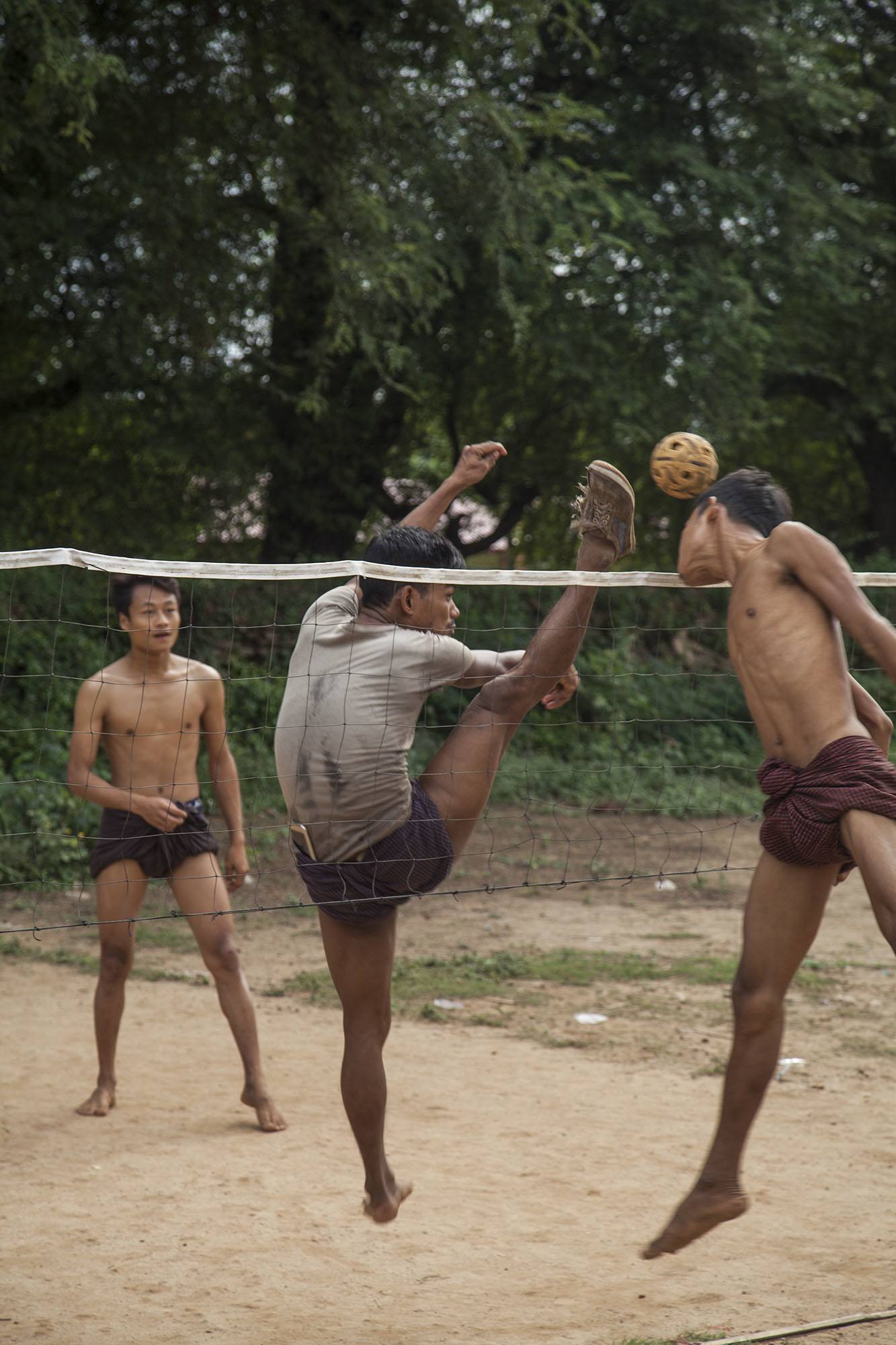 Young men playing Chinlone outside Lyay Htat Gyi in Inwa Myanmar