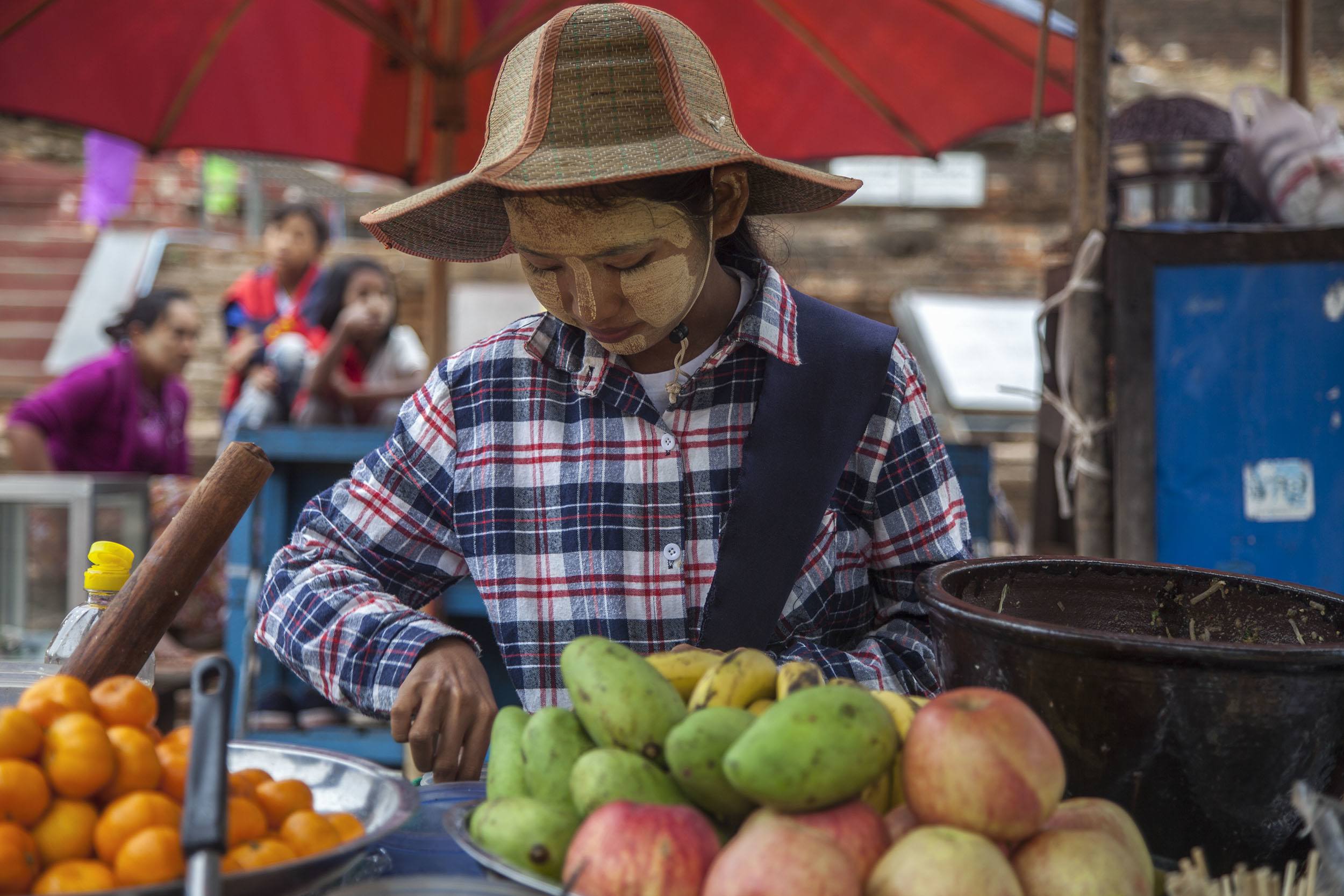 Young woman wearing nap hka at a market in Mingun Myanmar