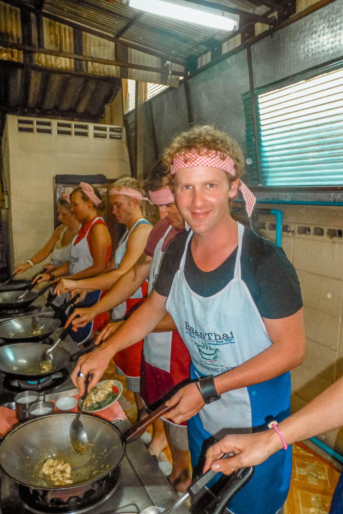 5 Ben using a wok at Baan Thai cooking school in Chiang Mai, Thailand