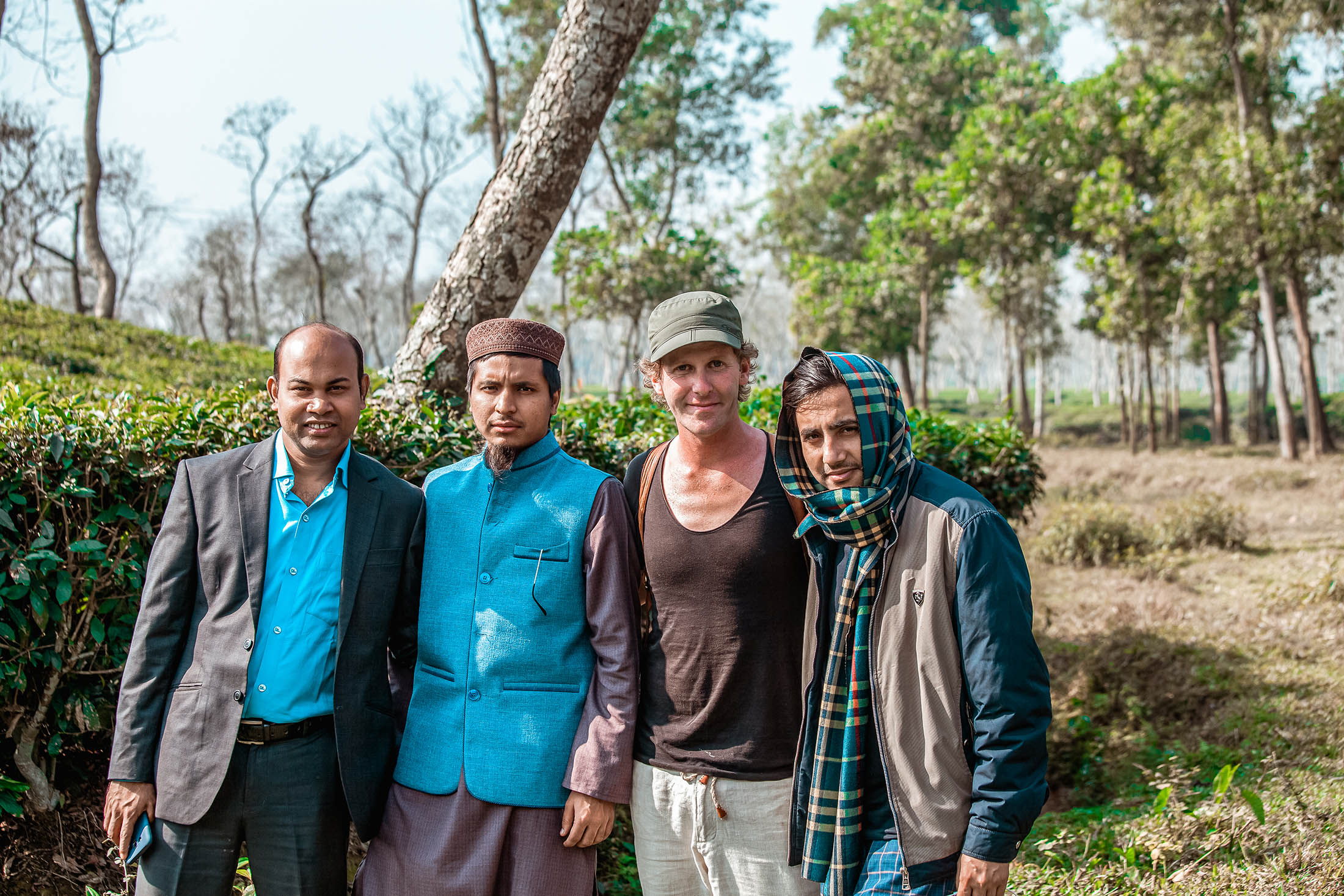 Ben with locals while walking through fields in Sreemangal, Bangaldesh