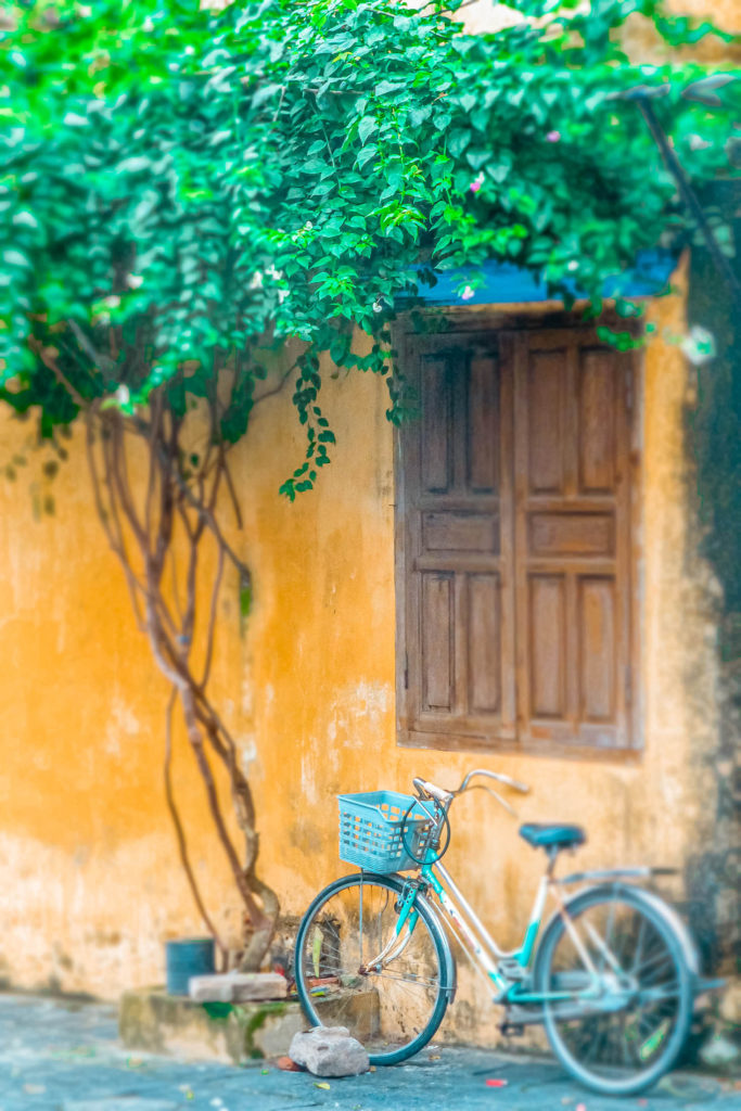 Bicycle against colourful wall in Hoi An, Vietnam